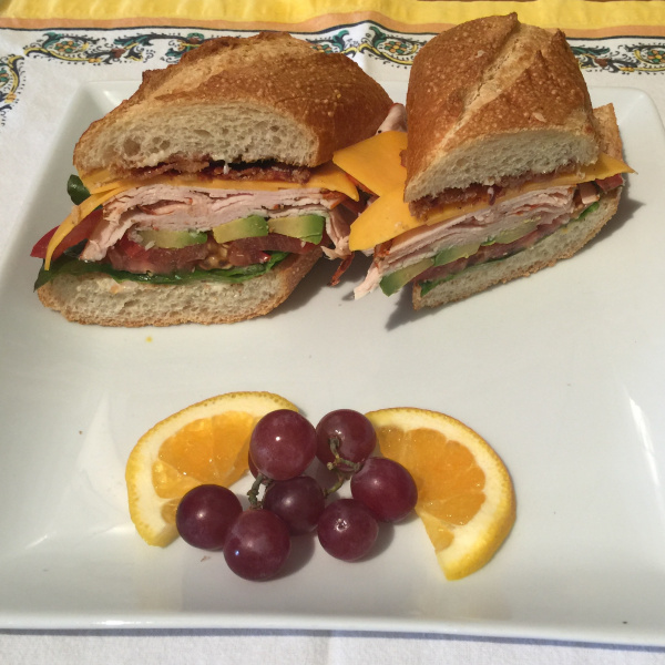 Order Crack'd Pepper Turkey BLTA and C Sandwich food online from Il Sogno Deli store, Los Angeles on bringmethat.com