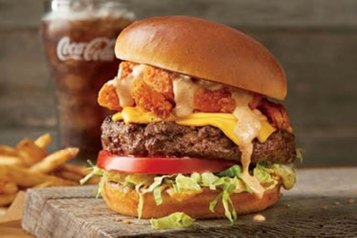 Order The Bloomin' Burger®* food online from Outback Steakhouse store, Cincinnati on bringmethat.com