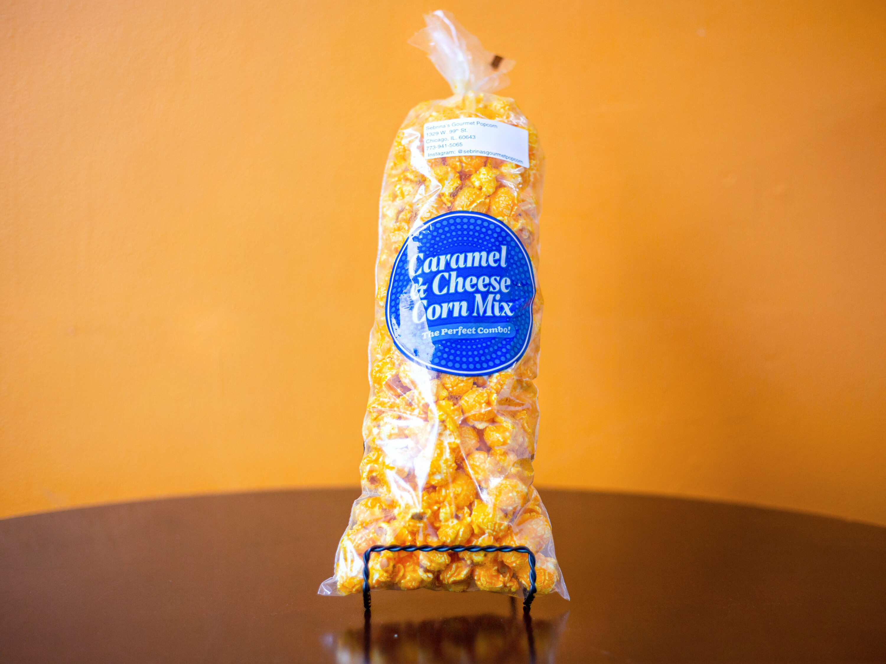 Order Cheese and Caramel with Nuts Medium food online from Sebrina's Gourmet Popcorn store, Chicago on bringmethat.com
