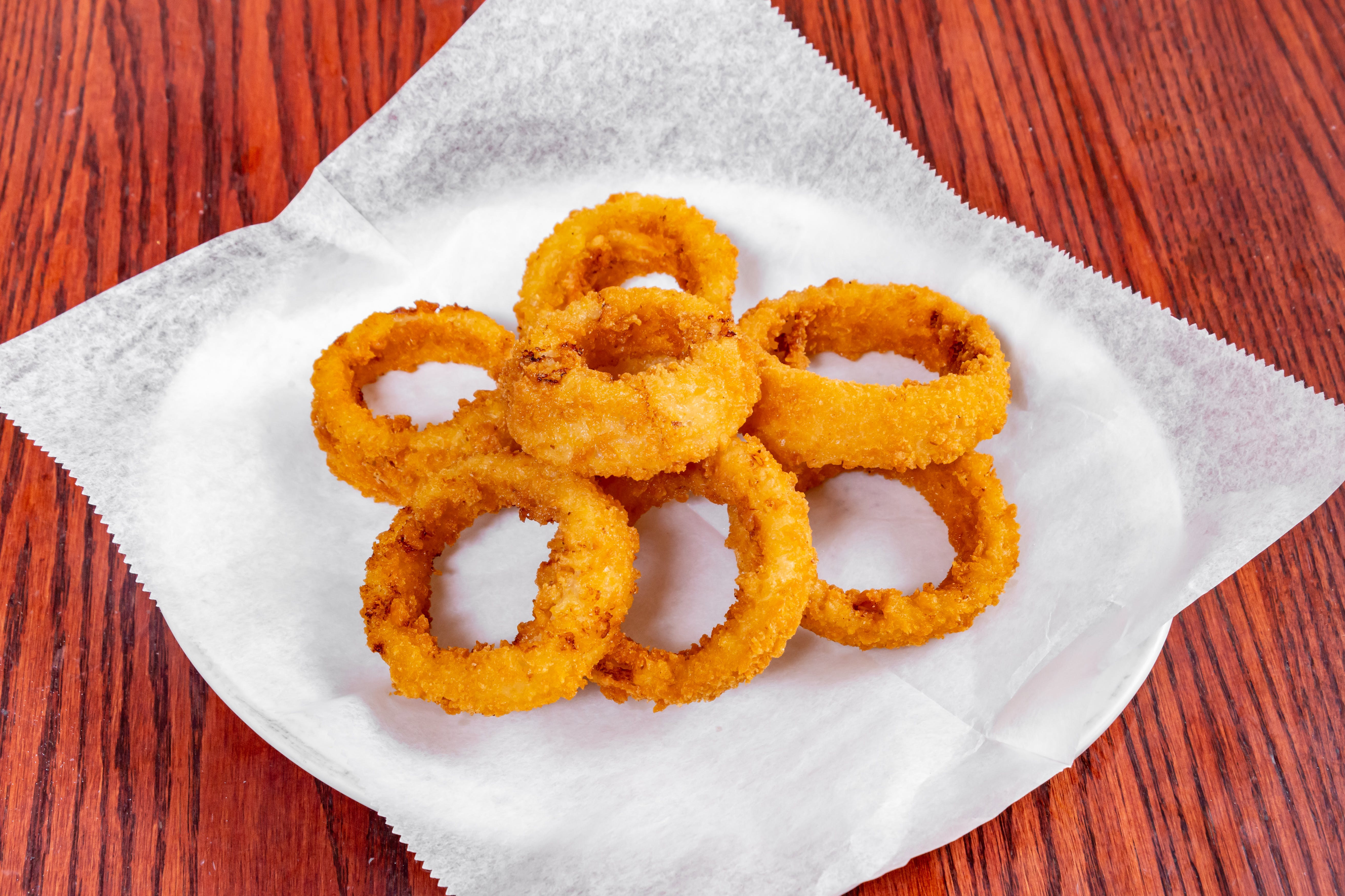 Order Onion Rings - Appetizer food online from Rocco's Pizza Restaurant store, Kimberton on bringmethat.com