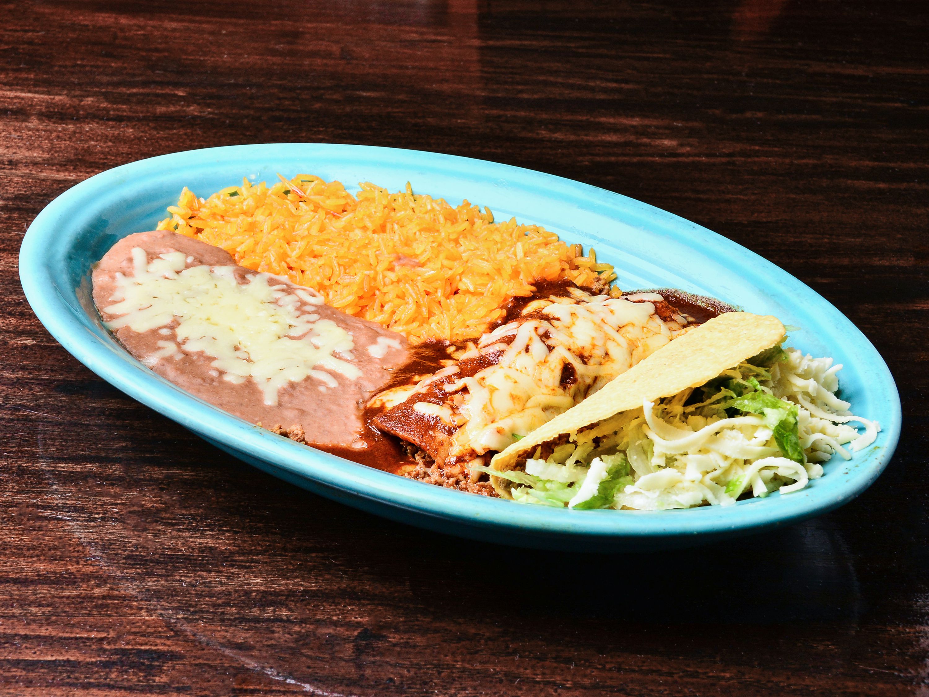 Order 11. Enchilada, Taco, Rice and Beans Combo food online from El Herradero Mexican Grill store, Piqua on bringmethat.com