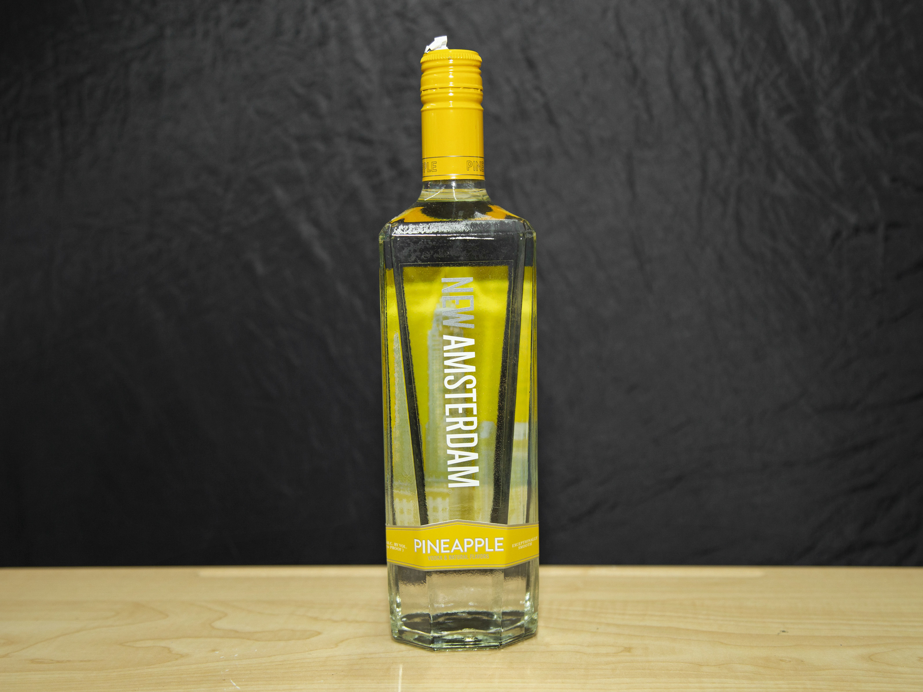 Order New Amsterdam Pineapple Flavored, 750 ml. Vodka (35.0% ABV) food online from Platinum Star Food & Liquor store, Chicago on bringmethat.com
