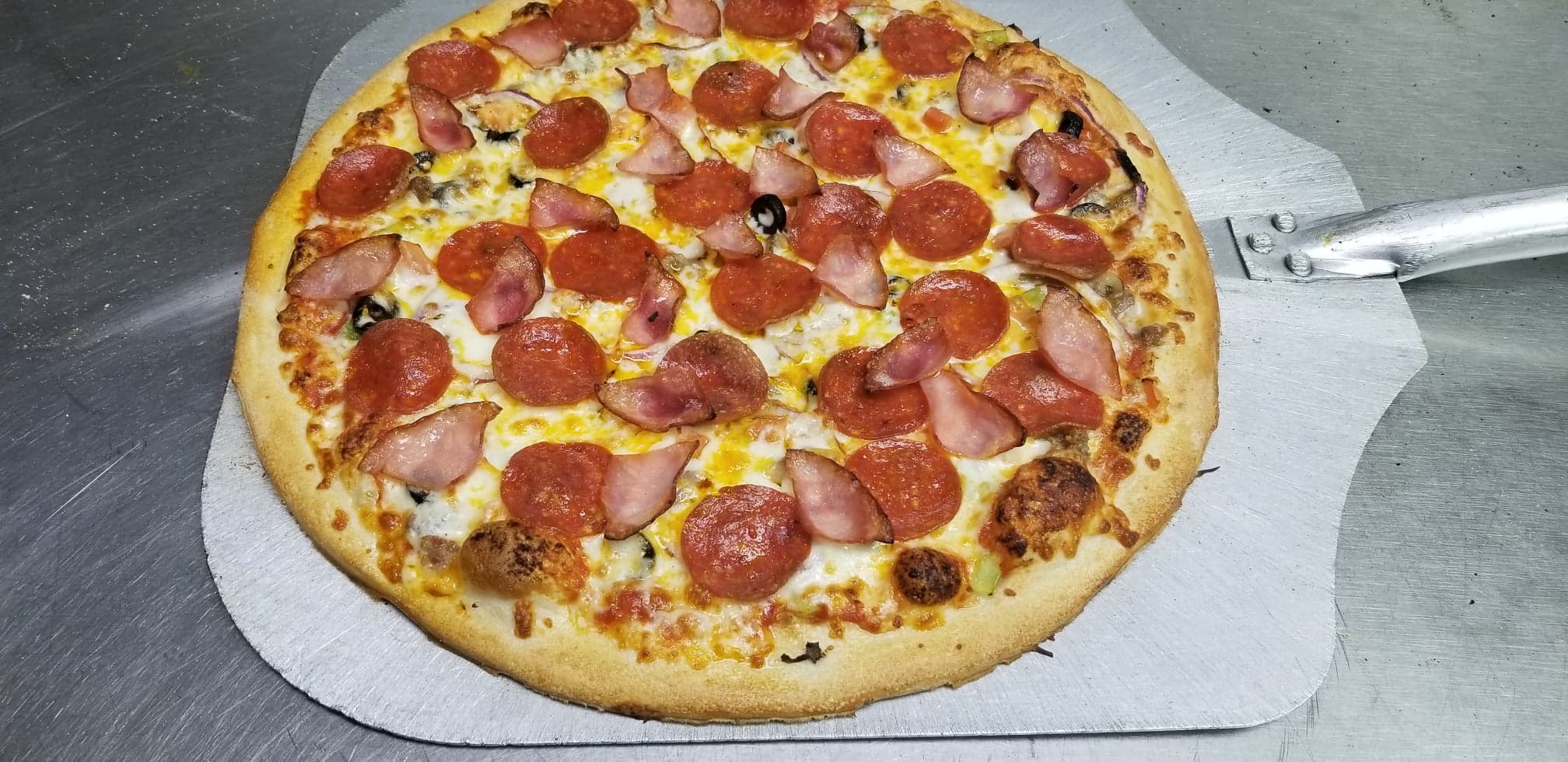 Order 3 Meat Combo Pizza food online from Electric Pizzeria store, Wichita on bringmethat.com