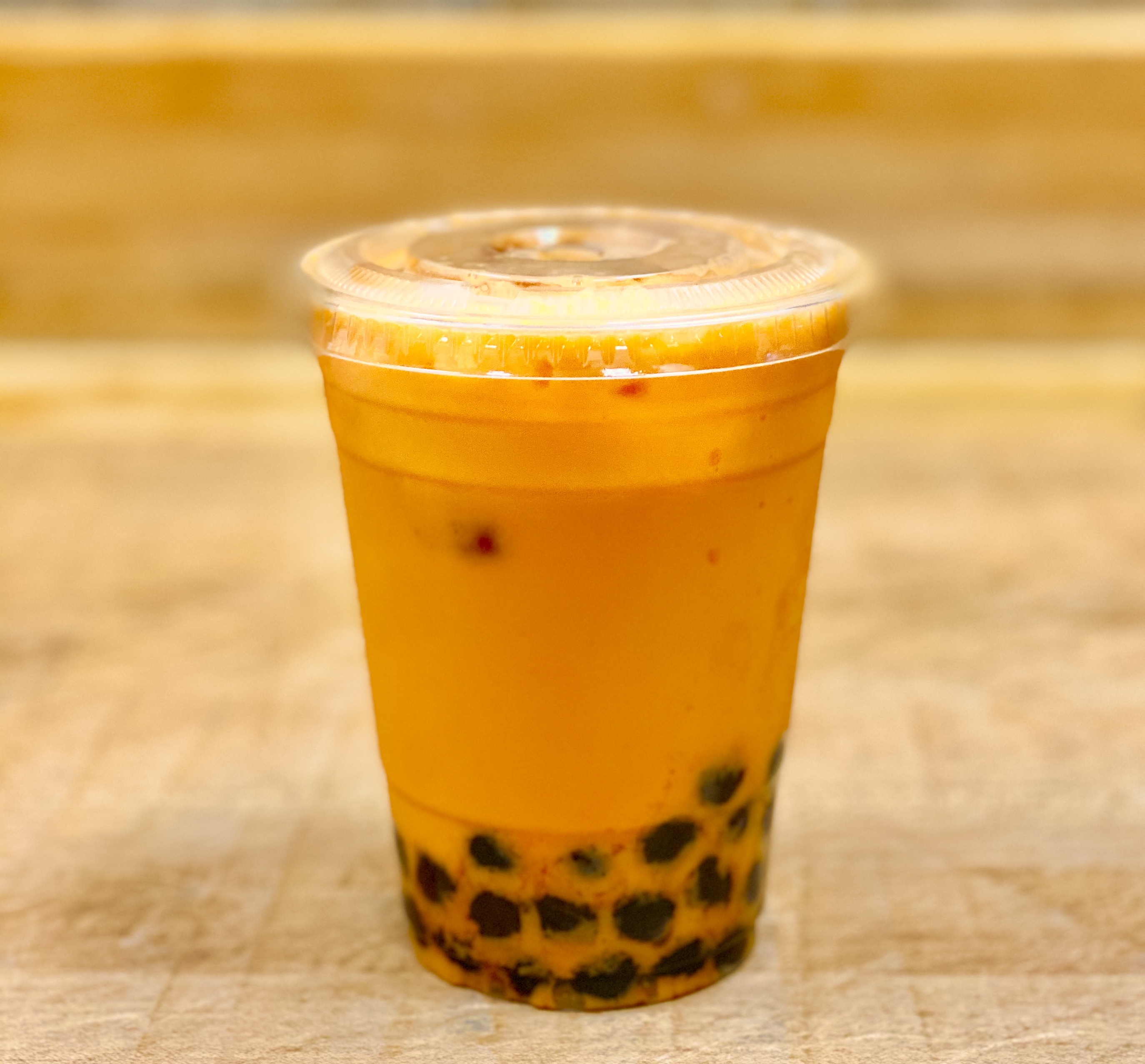 Order Thai Tea On Ice food online from K-Inn Donuts store, Paramount on bringmethat.com