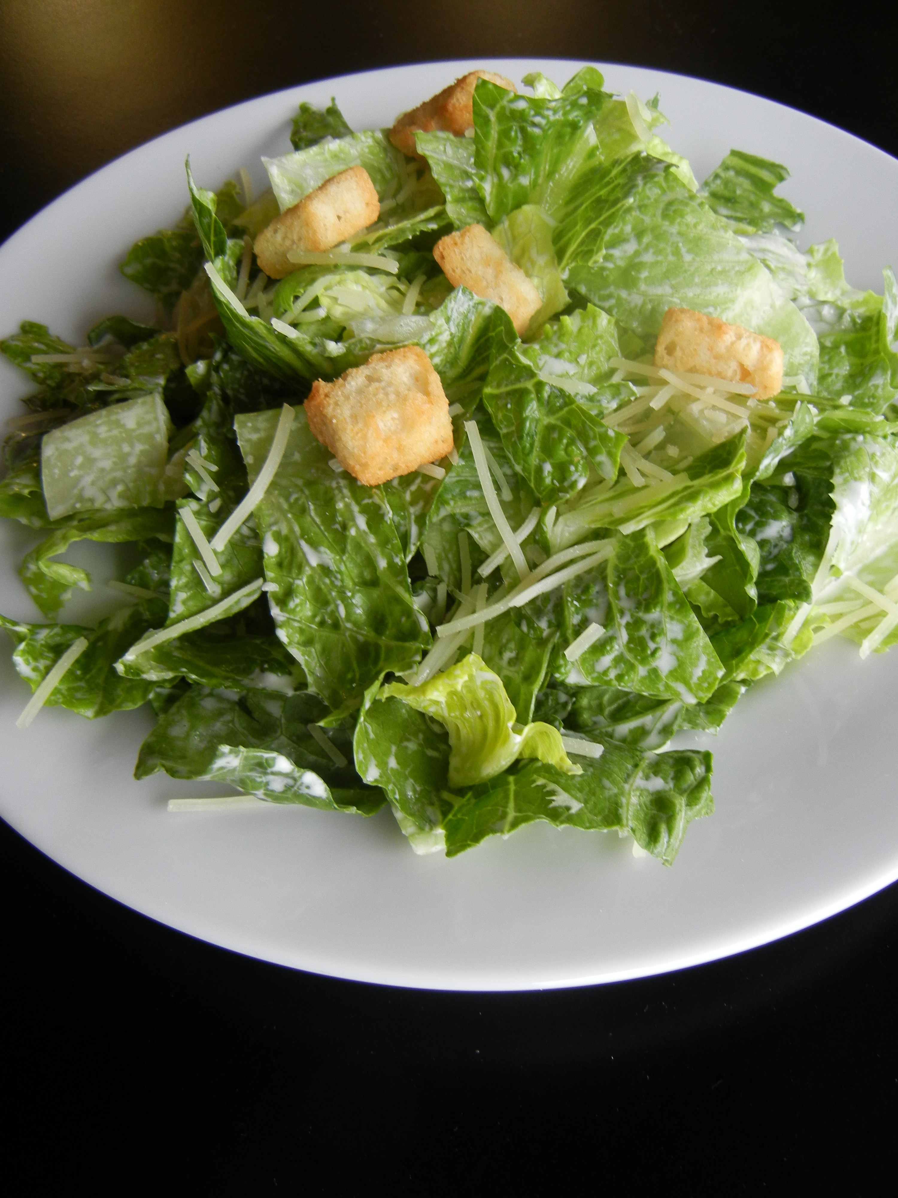 Order Caesar Salad food online from Craigo's Pizza & Pastaria store, Austin on bringmethat.com