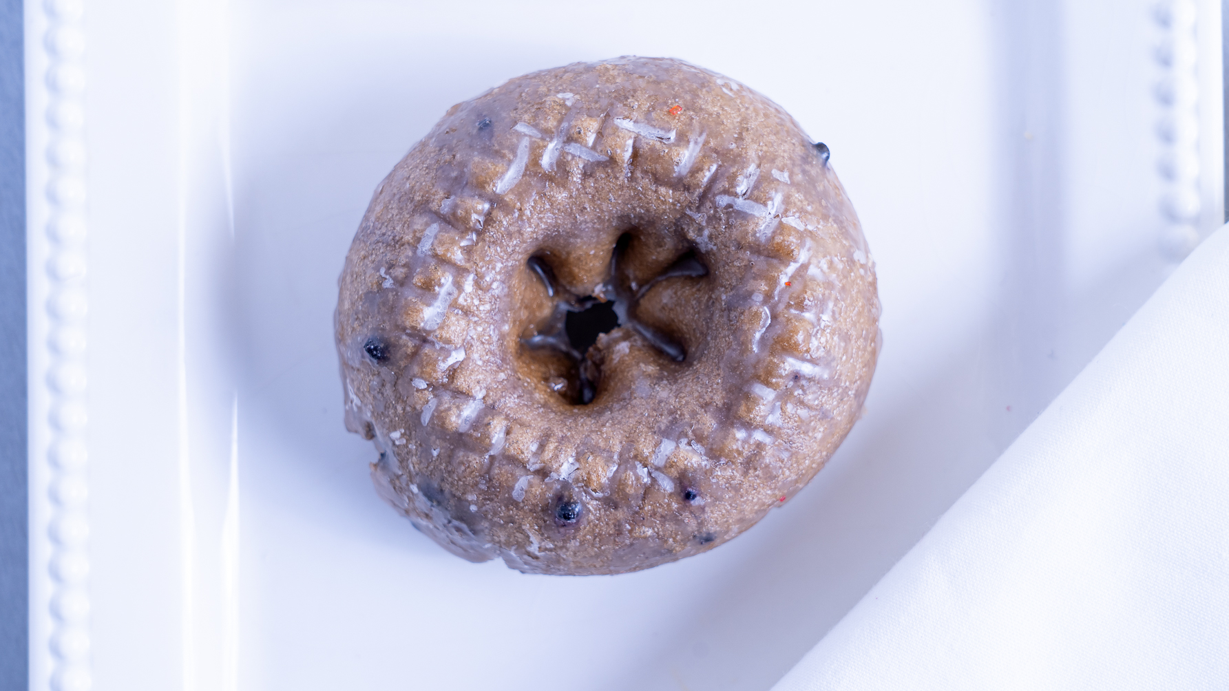 Order Blueberry Cake Donut food online from Bakers Dozen Donuts store, Sachse on bringmethat.com
