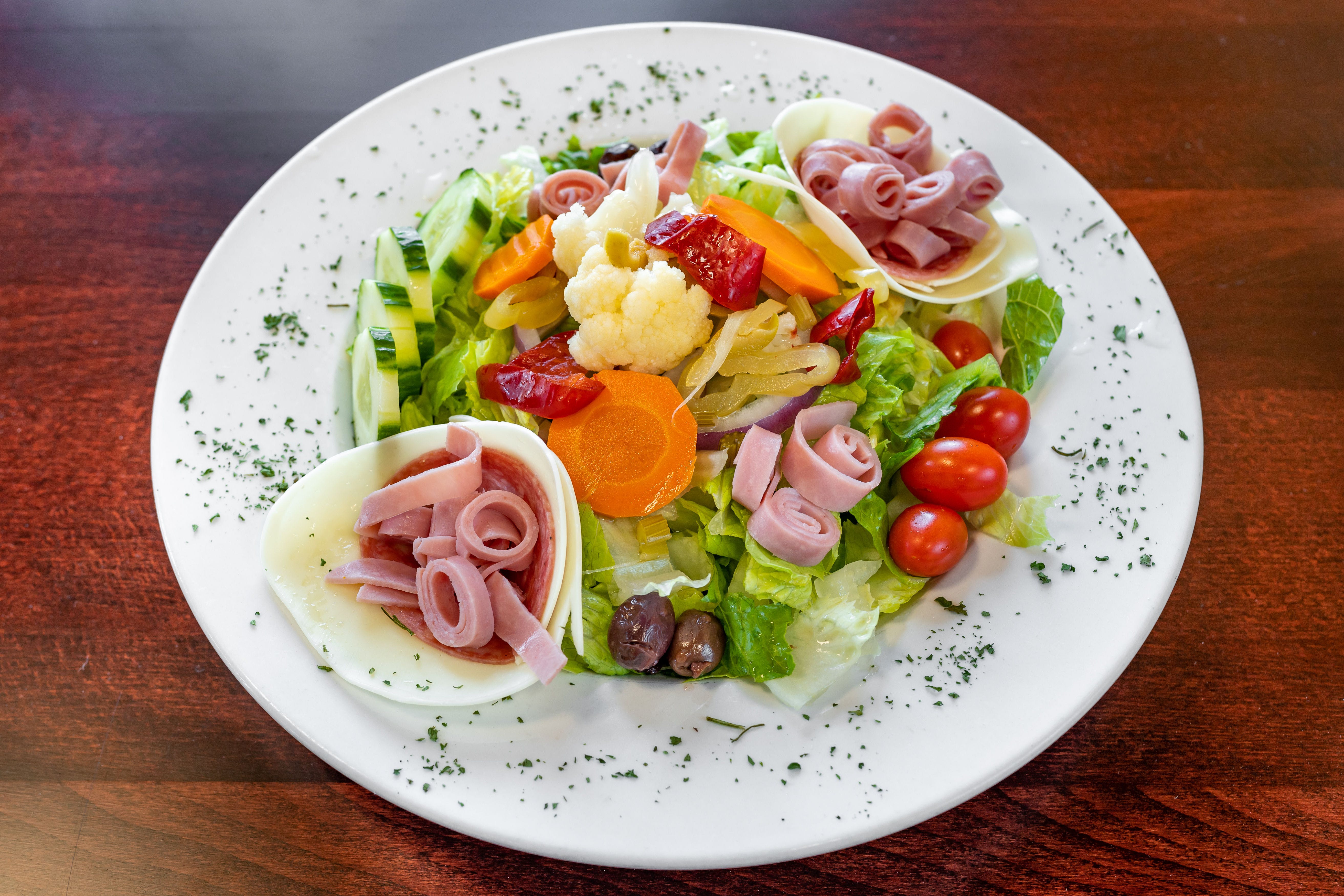 Order Antipasto Salad - Entree food online from Capriccios Italian Restaurant store, Henrico on bringmethat.com