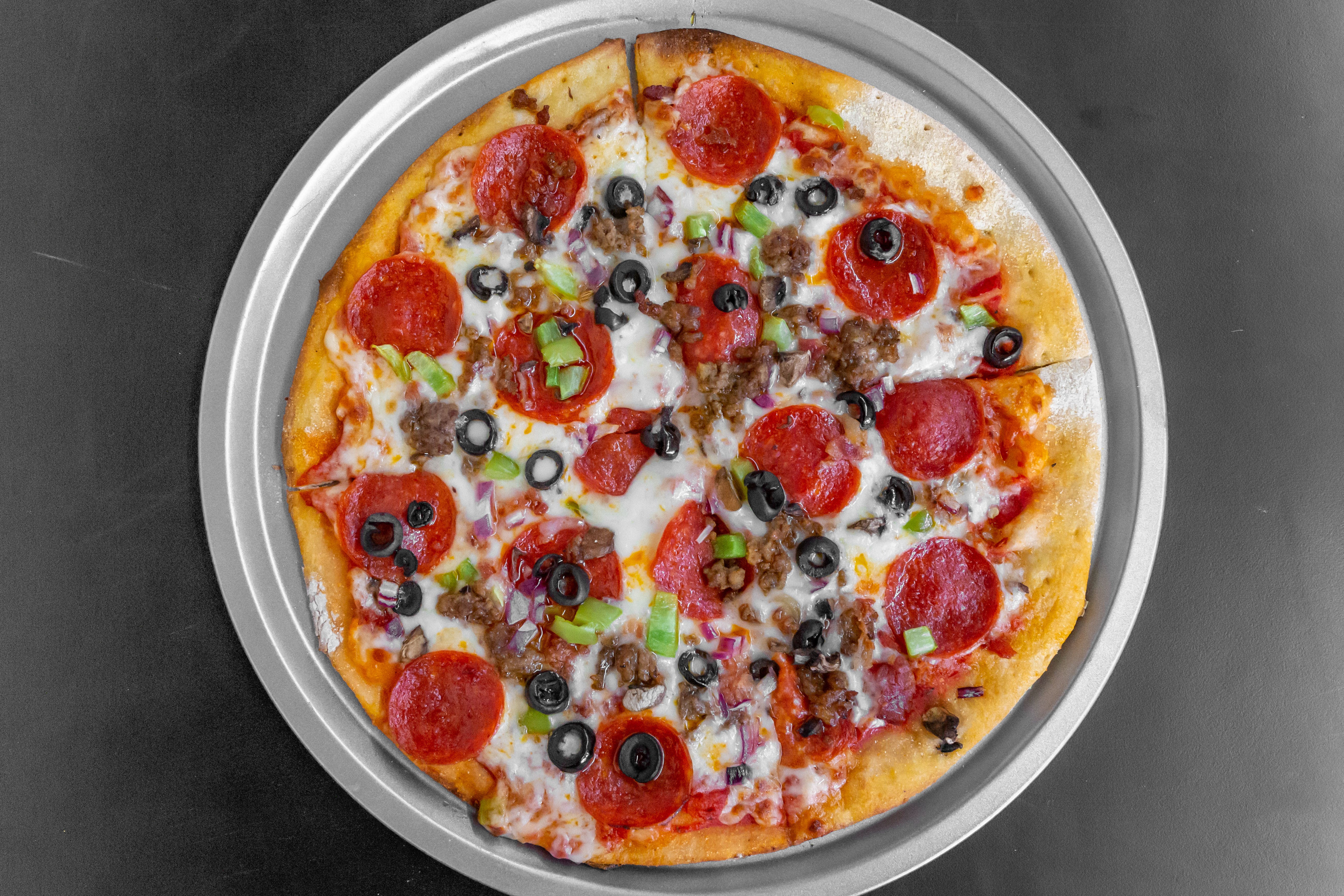 Order New York Deluxe Pizza - Personal 10" food online from New York Pizzeria & Catering store, Dobson on bringmethat.com
