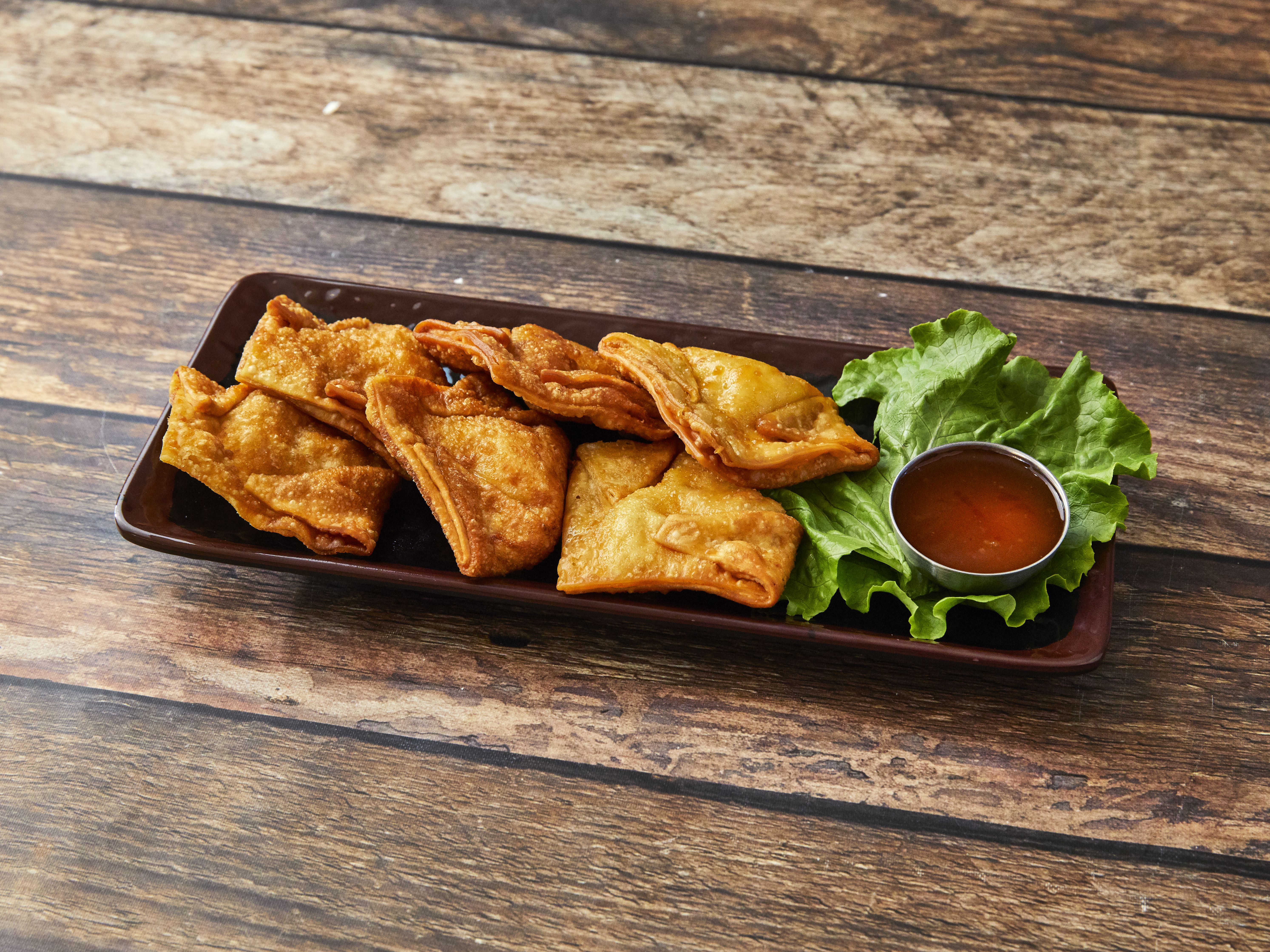 Order 104. Crabmeat Rangoons food online from Potsticker House store, Chicago on bringmethat.com