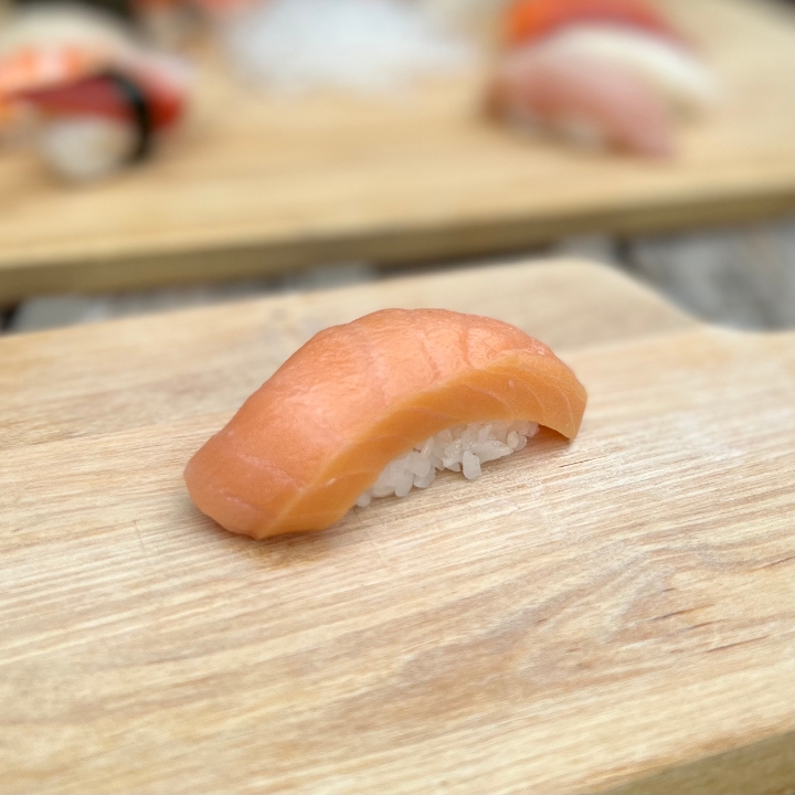 Order Zuke Sake Nigiri food online from Tanuki sushi store, Chicago on bringmethat.com