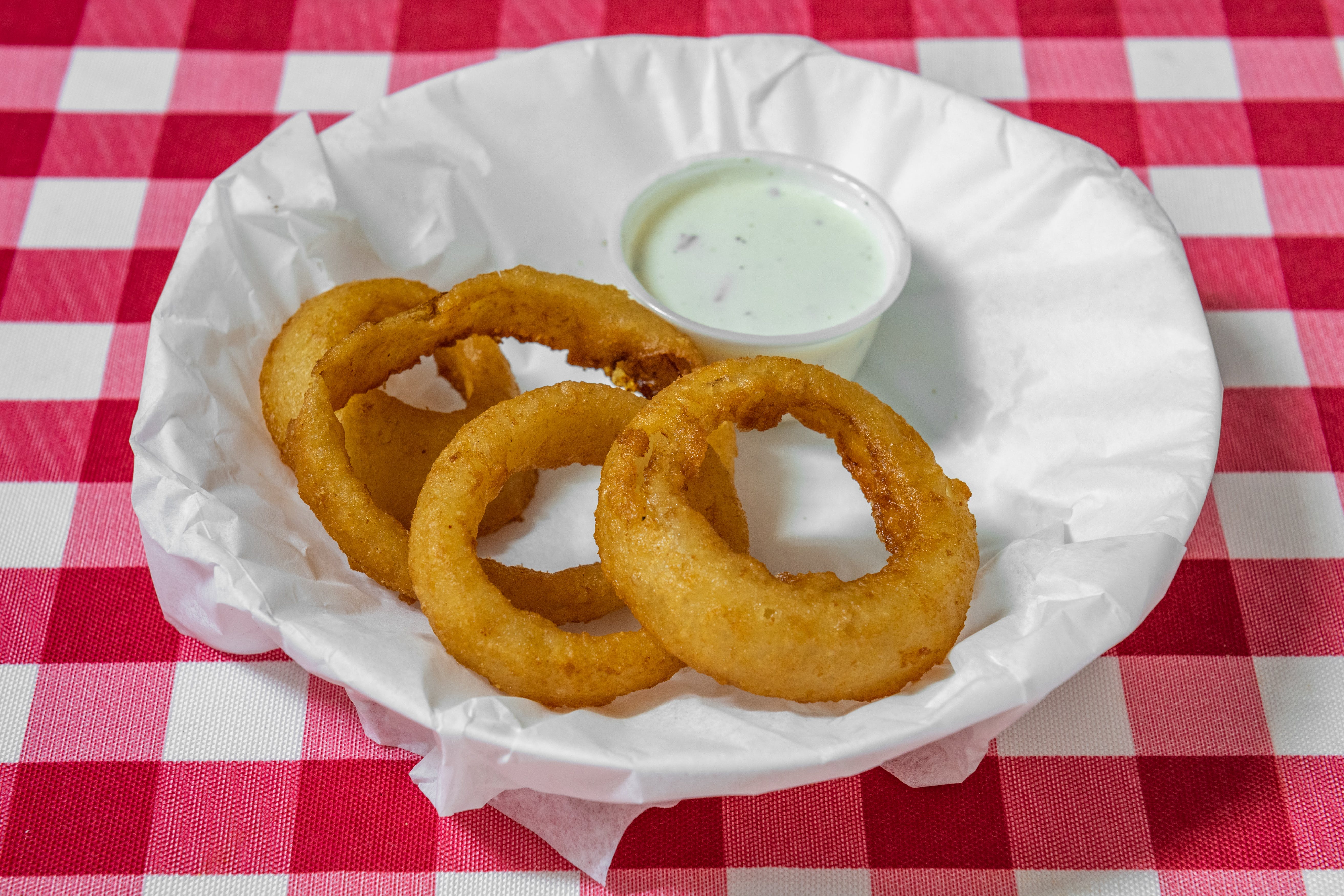 Order Onion Rings - 6 Pieces food online from Sunny's Pizza store, San Marcos on bringmethat.com