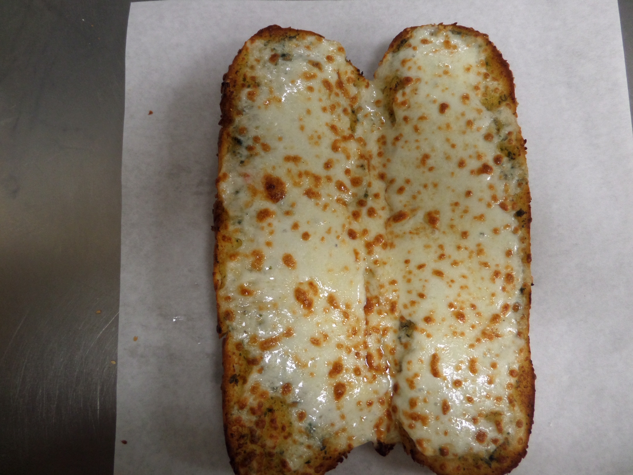 Order Garlic Bread with Cheese food online from Guido's Pizza and Pasta store, Winnetka on bringmethat.com