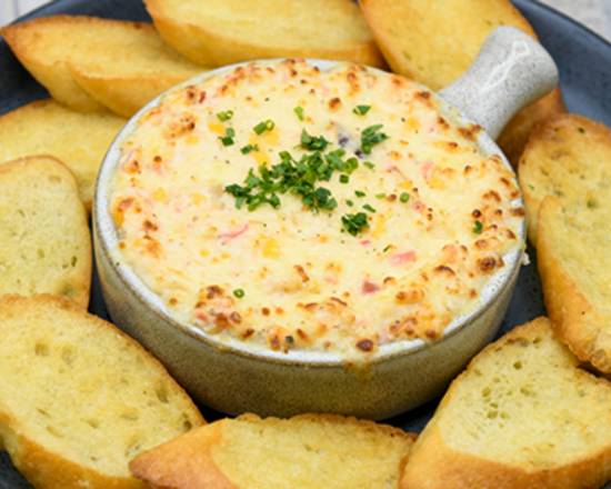 Order Hot Crab + Artichoke Dip food online from Simon & Seaforts store, Anchorage on bringmethat.com