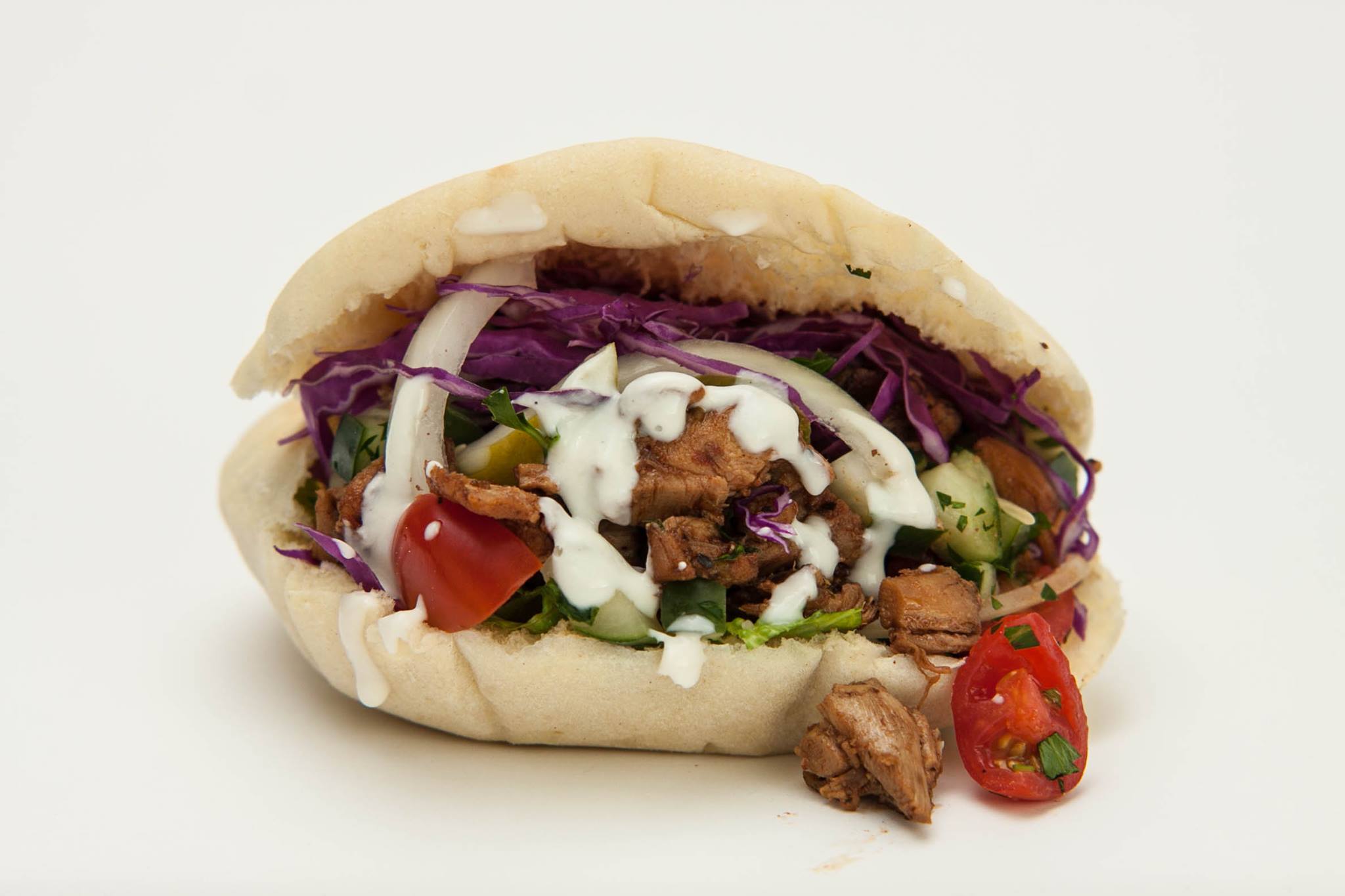 Order Chicken Shawarma Pita food online from Mezza Grilled Wraps and Pitas store, Chicago on bringmethat.com