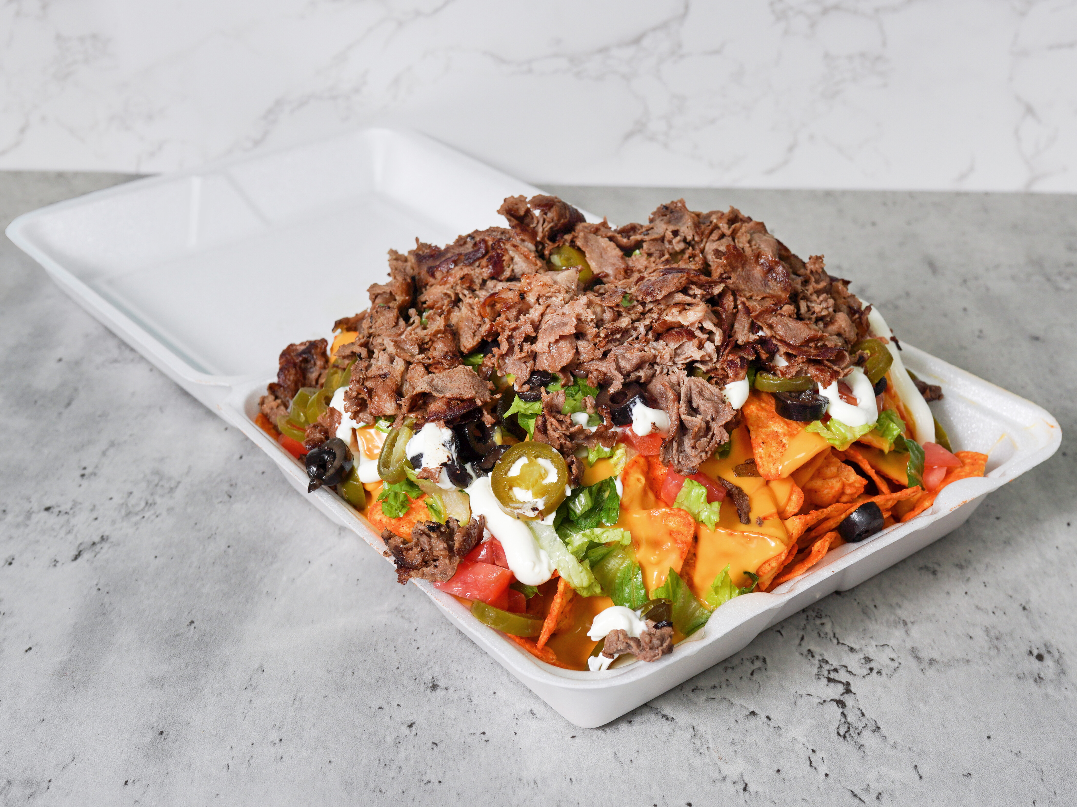 Order Nachos food online from Tony's Philly Steak store, Chicago on bringmethat.com