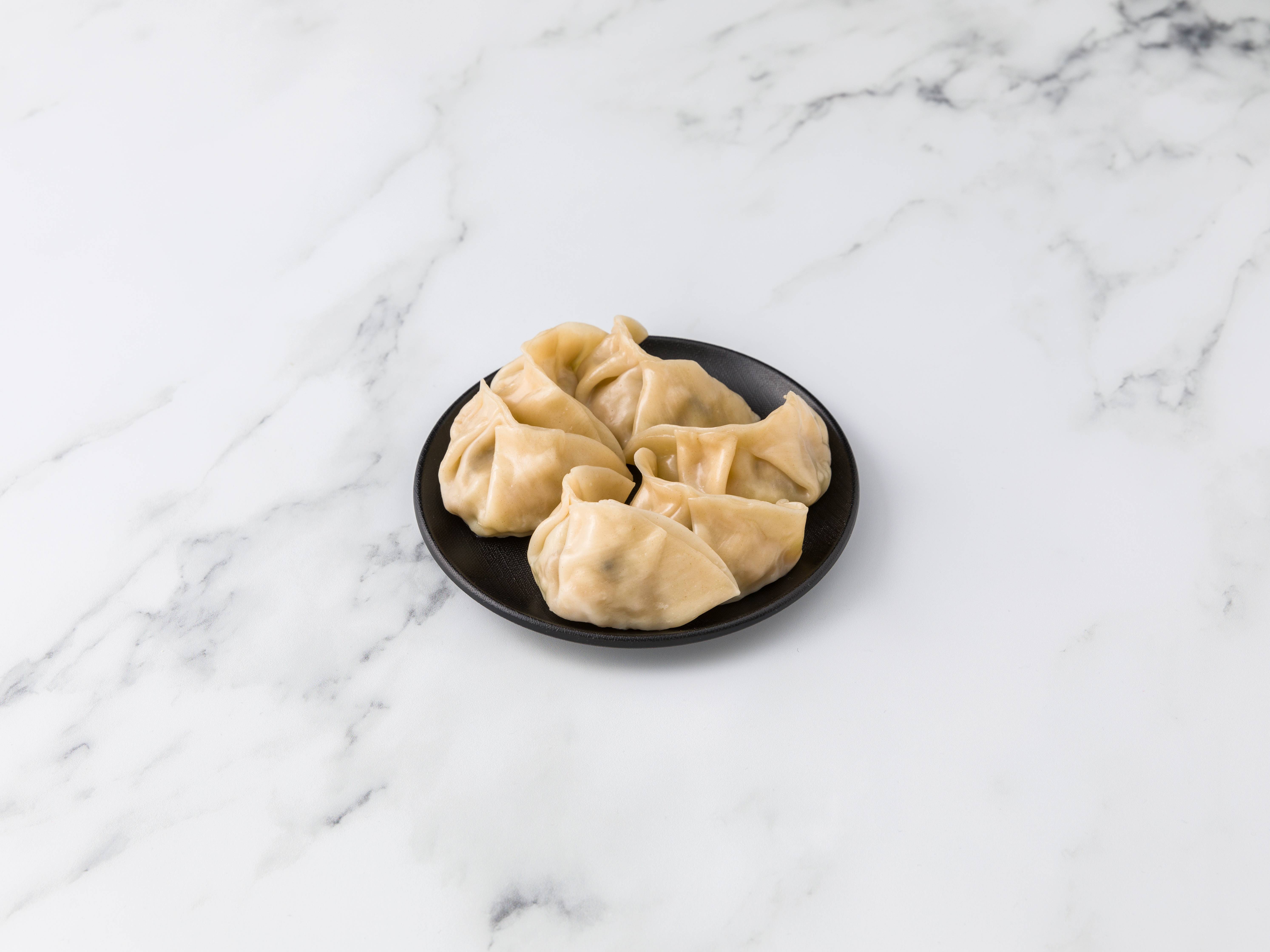 Order Steamed Chicken Dumplings food online from Canton Lounge store, New York on bringmethat.com