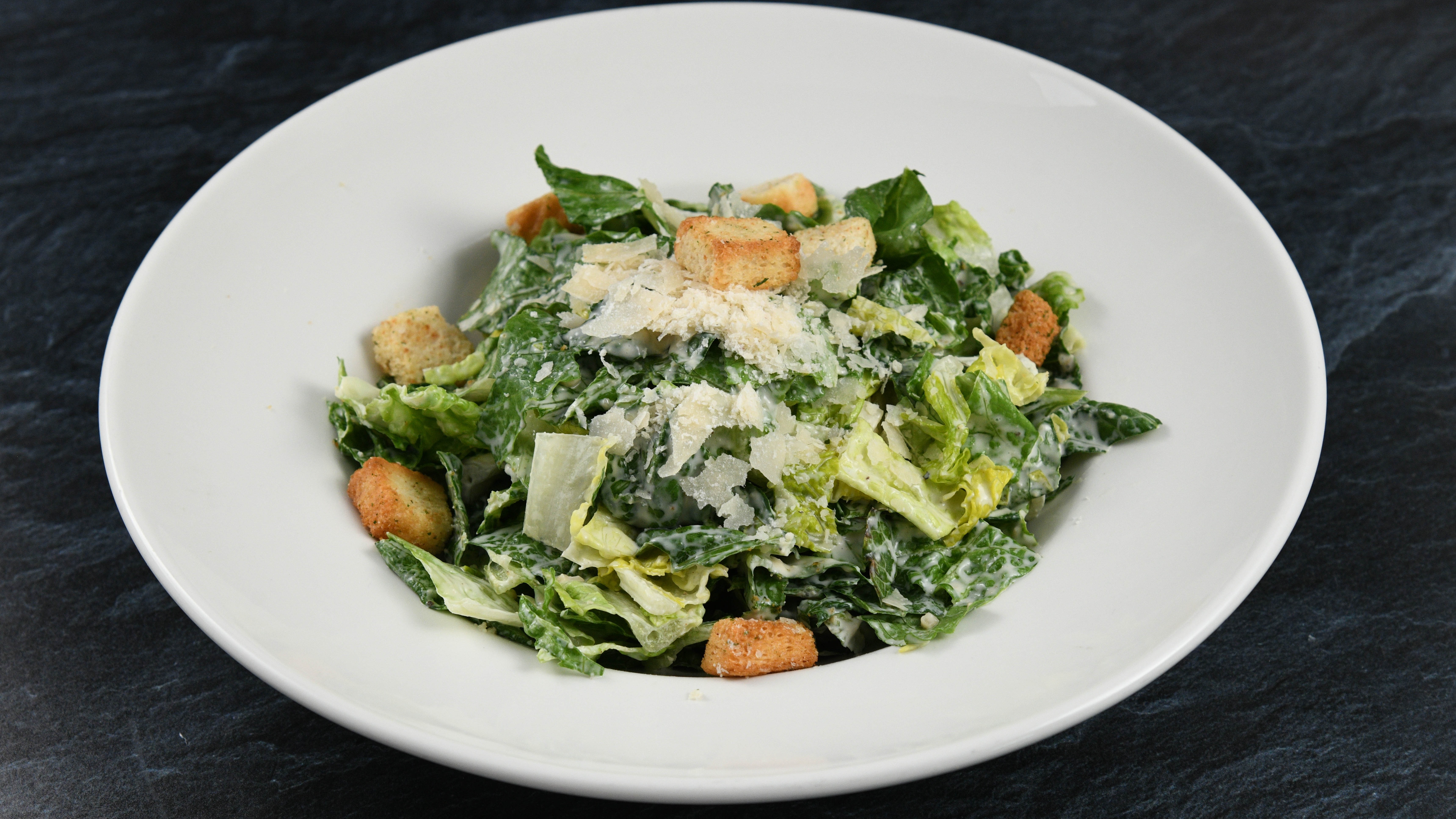 Order Big Islander Caesar Salad food online from Rainforest Cafe store, Tempe on bringmethat.com