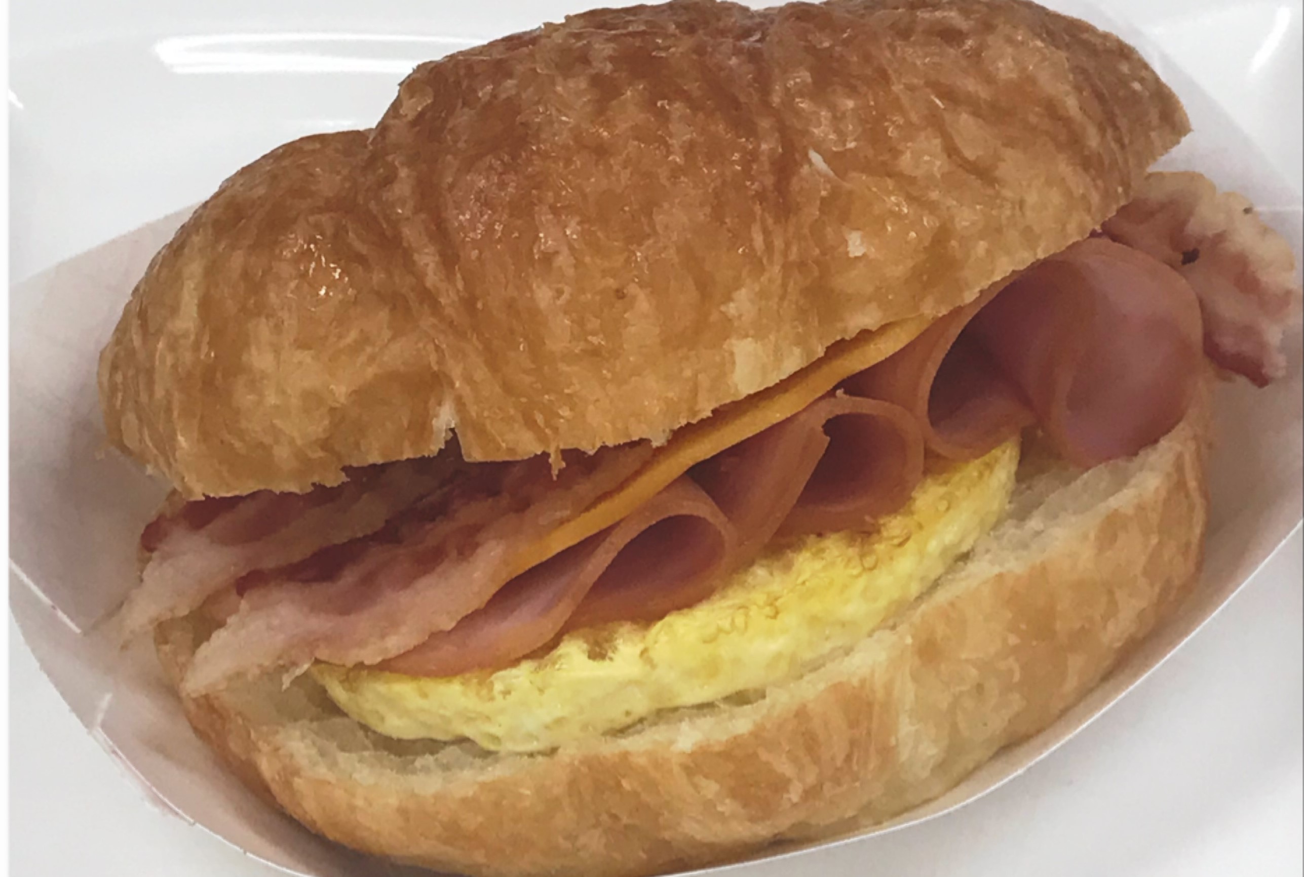 Order Ham, Egg, and Cheese Croissant food online from Saginaw Donut Shop store, Saginaw on bringmethat.com