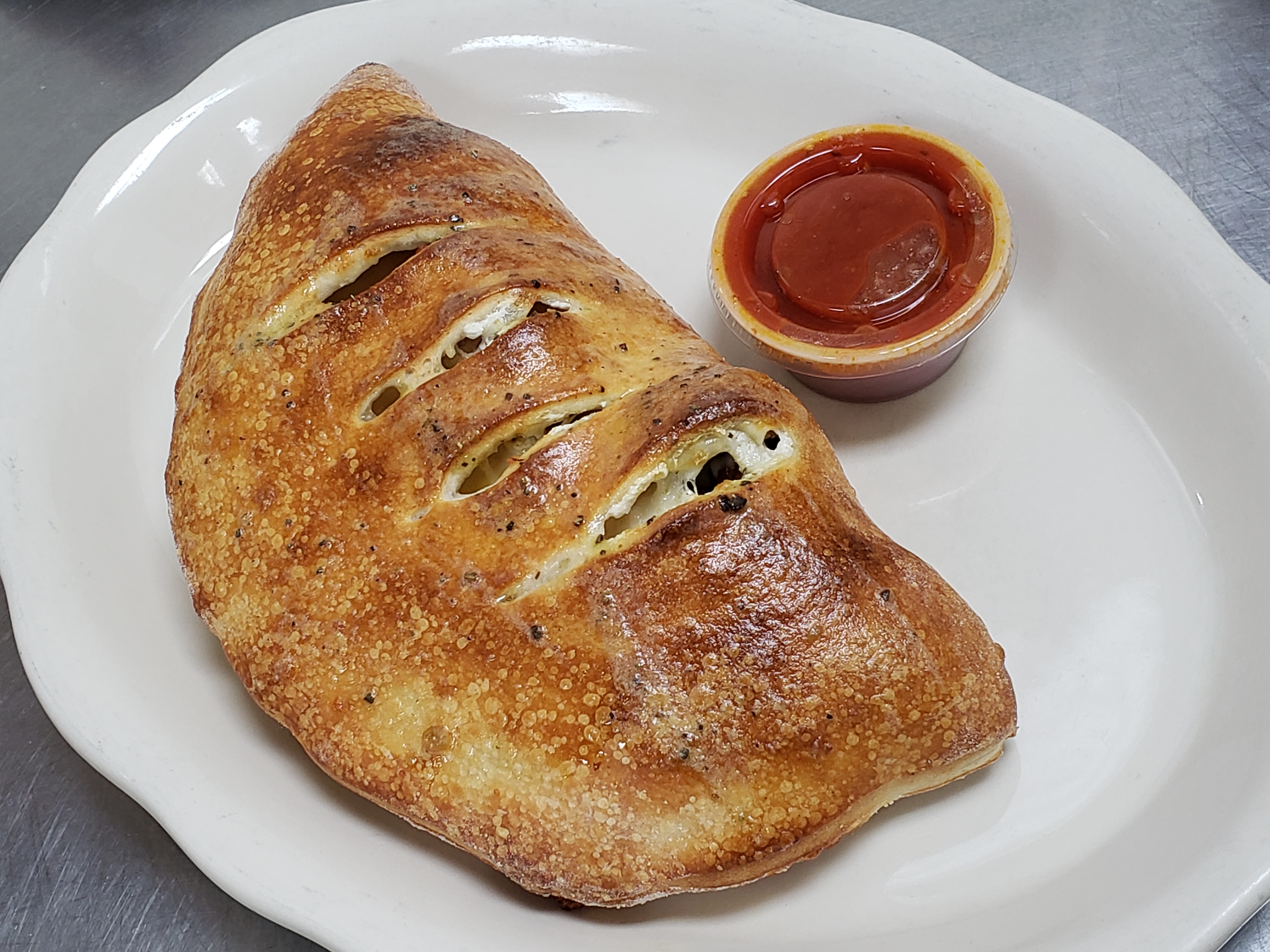 Order Meatball Calzone food online from Illianos Pizza store, Clemmons on bringmethat.com