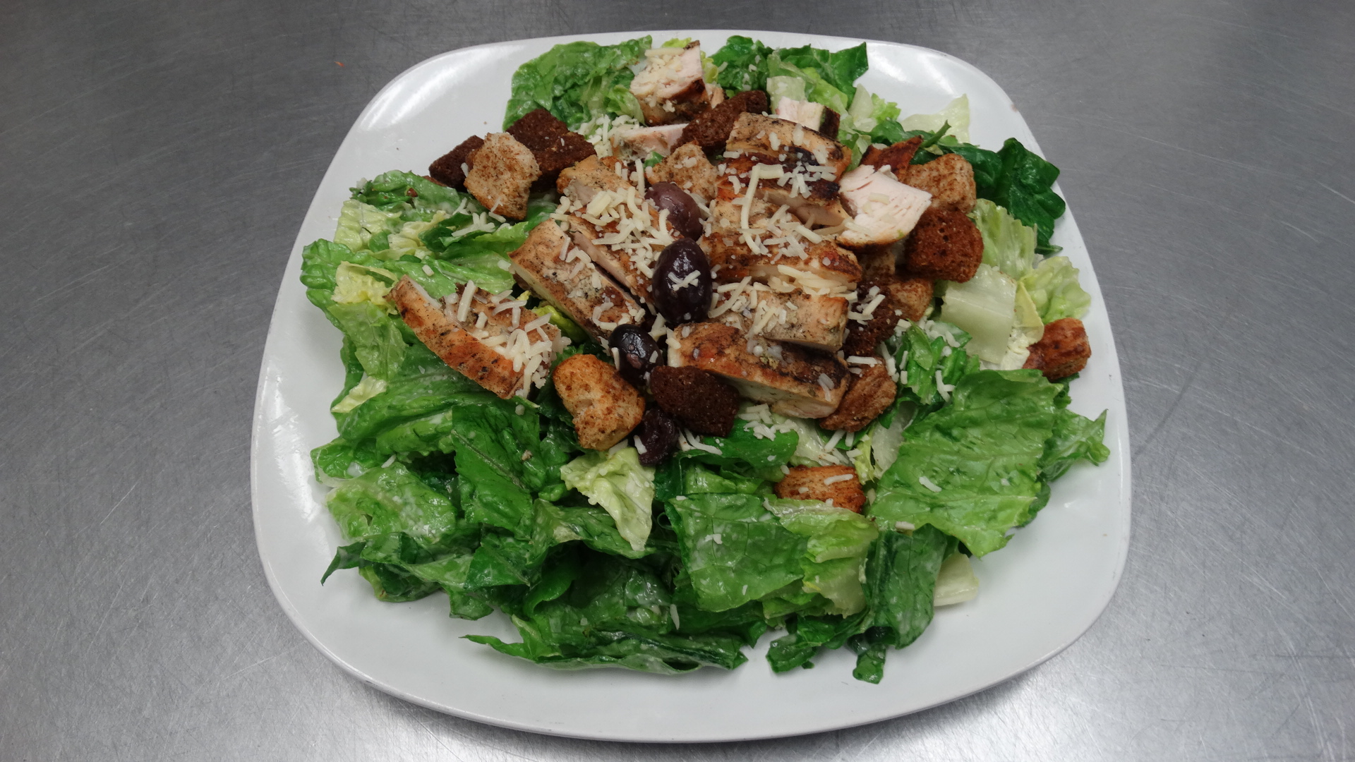 Order Grilled Chicken Caesar Salad food online from Di Marcos Pizza store, Santa Clarita on bringmethat.com