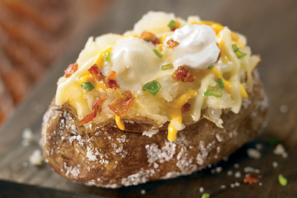 Order Dressed Baked Potato food online from Outback Steakhouse store, Rome on bringmethat.com
