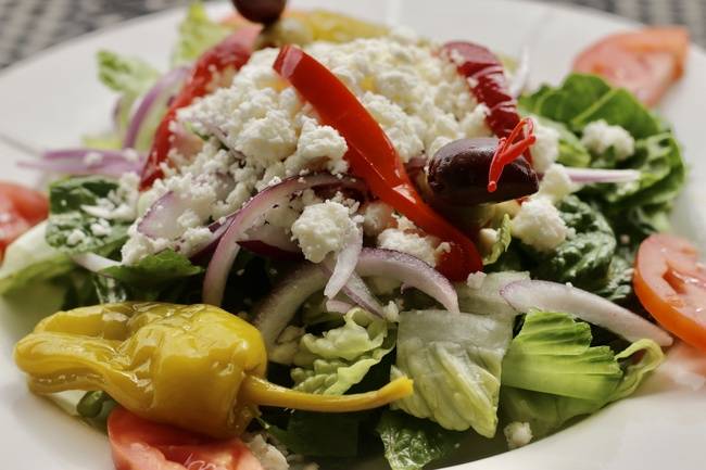Order Greek Salad food online from Bambinelli's store, Atlanta on bringmethat.com