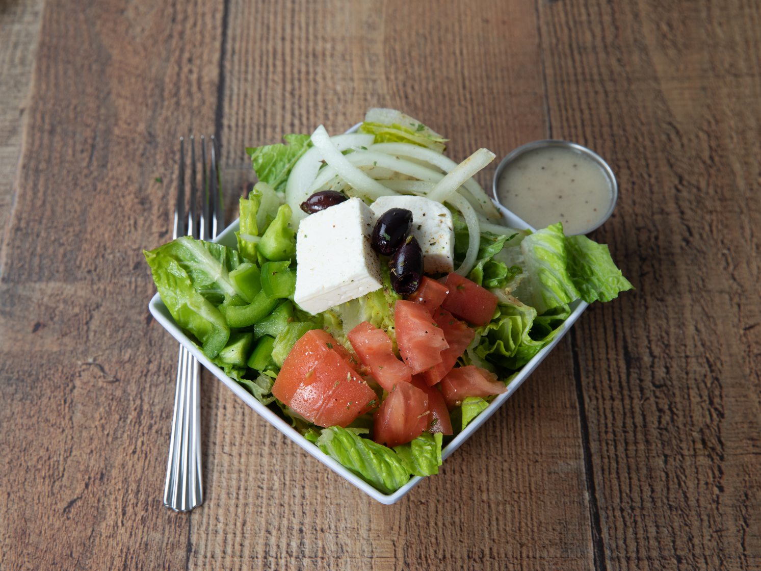 Order Greek Salad food online from Sidewalk Cafe store, Painesville on bringmethat.com