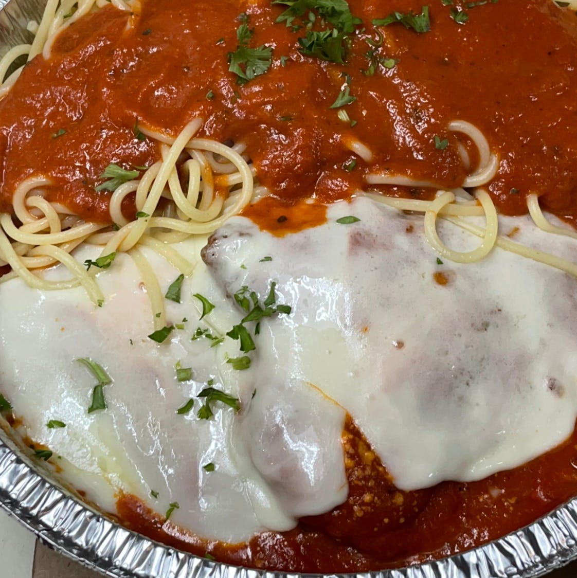 Order Veal Parmigiana - Entree food online from Davila's Pizza & Restaurant store, Hackettstown on bringmethat.com