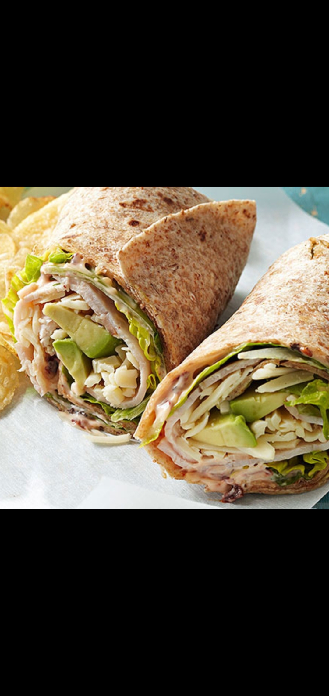 Order  Turkey Breast & Chipotle Wrap (pepper mill turkey  cheese avocado lettuce tomatoes & chipotle mayonnaise) food online from American Gourmet Foods Deli store, New York on bringmethat.com