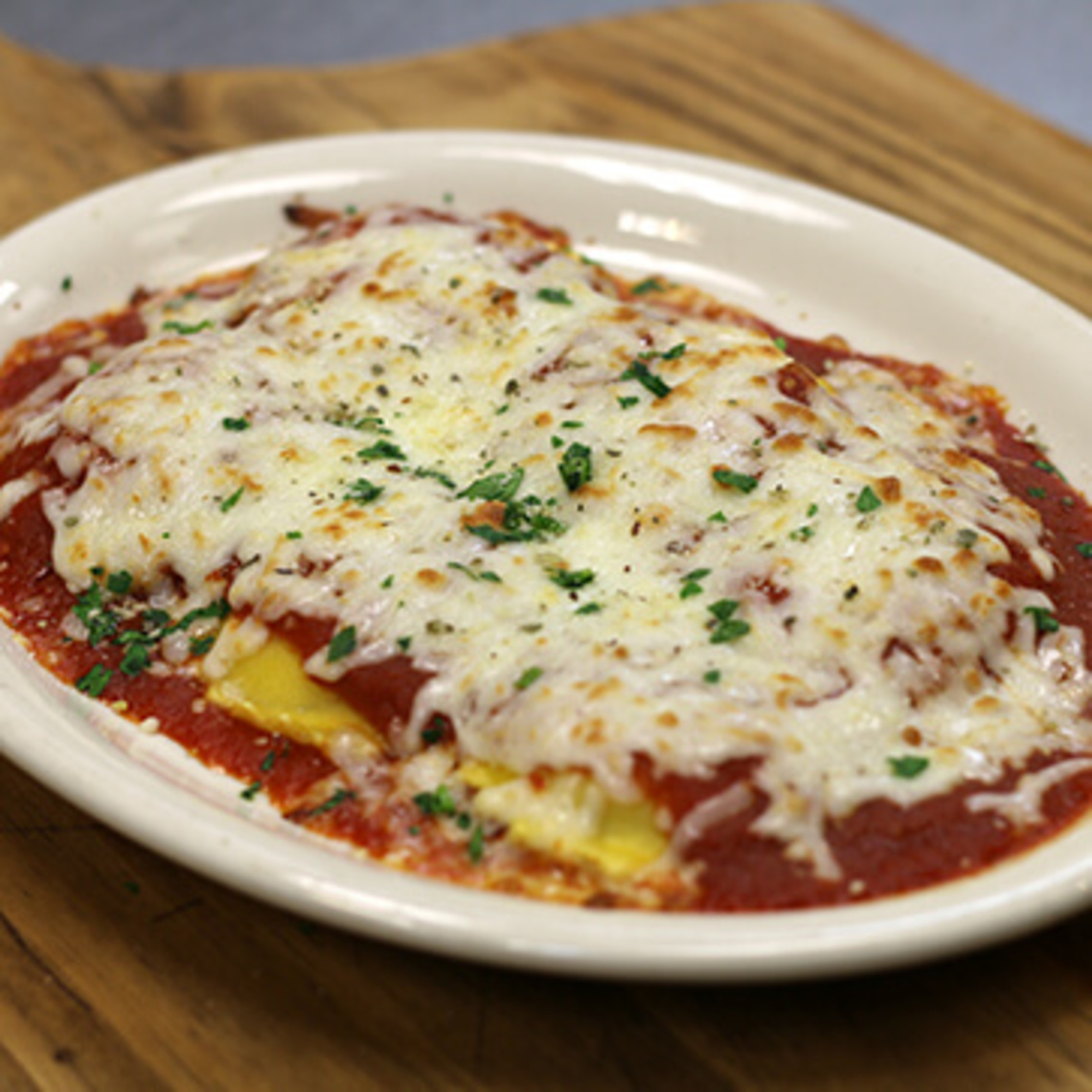 Order Baked Ricotta Cheese Ravioli food online from Mario Pizza store, Winston Salem on bringmethat.com
