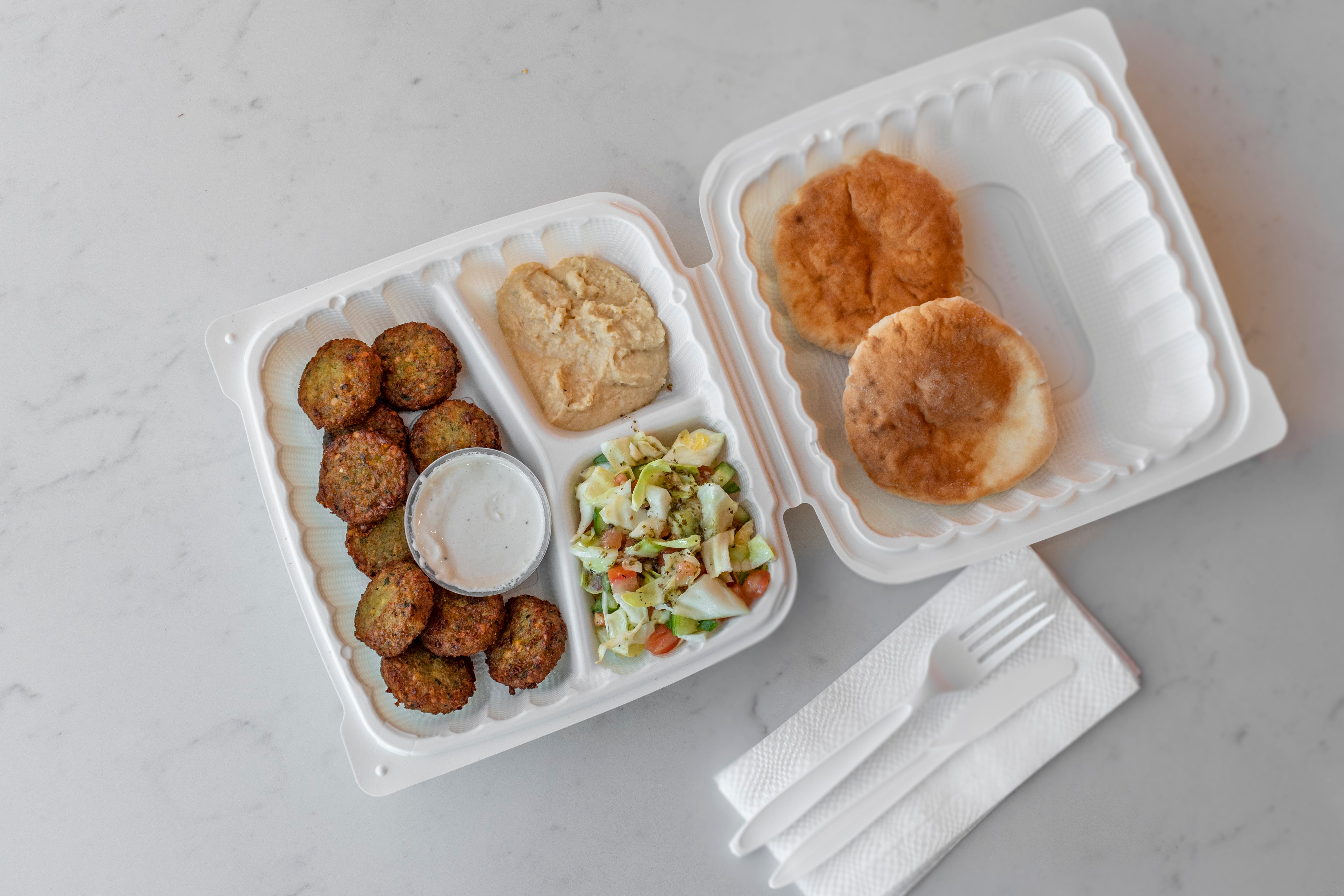Order Falafel Plate with 10 falafels humus tehini & pia - 10 Pieces food online from Pizza Mark store, Los Angeles on bringmethat.com
