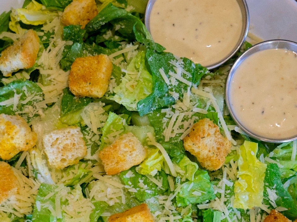 Order SM Caesar Salad food online from Palio Pizza Cafe store, Allen on bringmethat.com