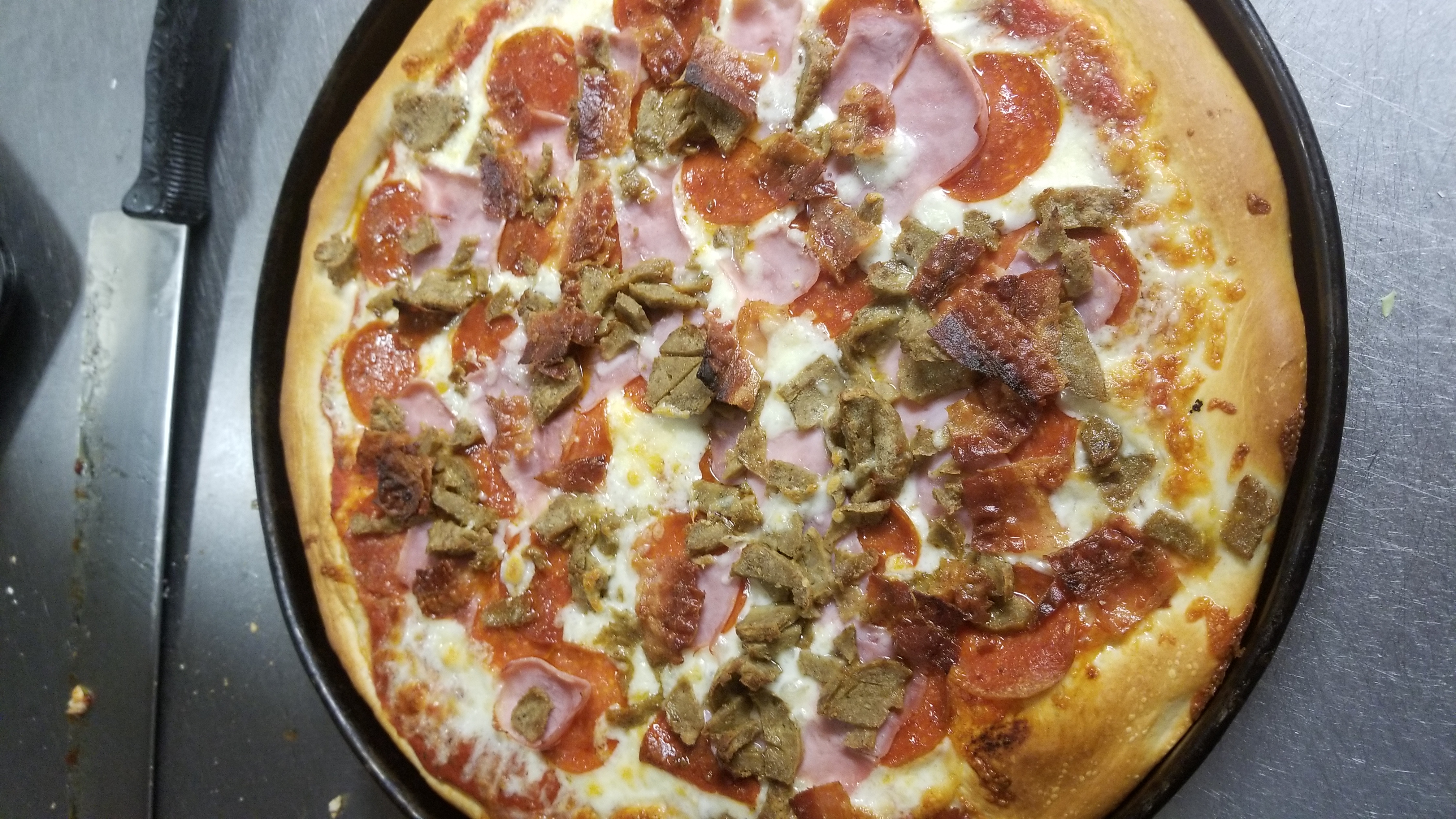 Order Meat Lovers Pizza food online from Sugar Bowl store, Millersville on bringmethat.com
