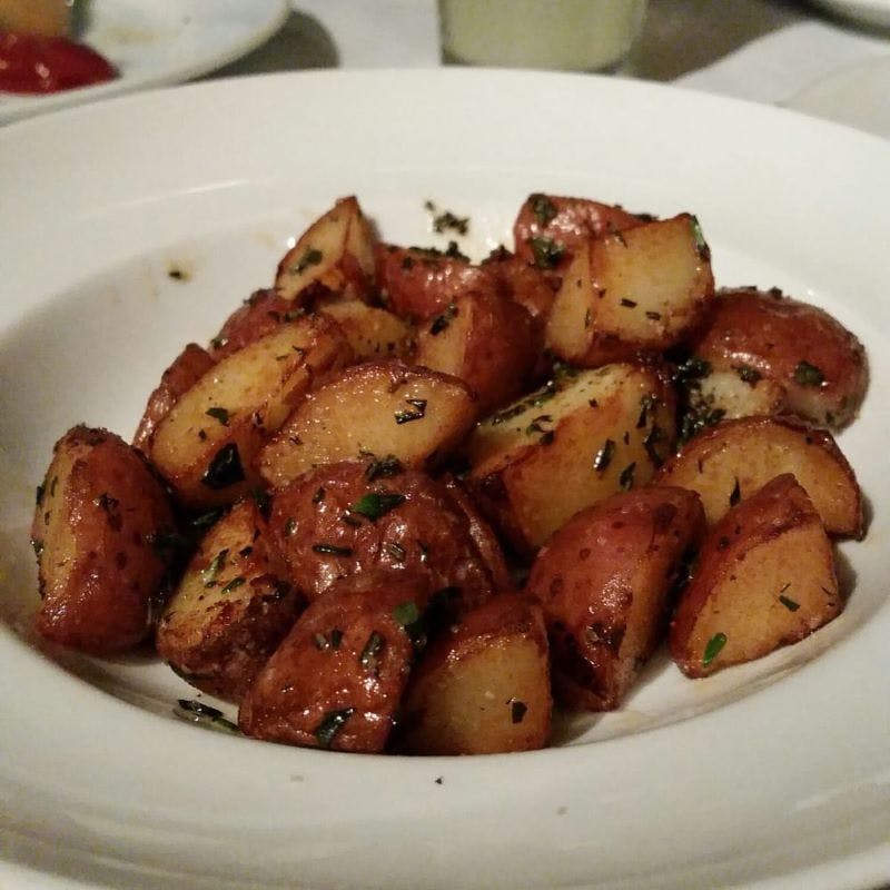 Order Roasted Herbed Potato - Side food online from Arturo Boada Cuisine store, Houston on bringmethat.com