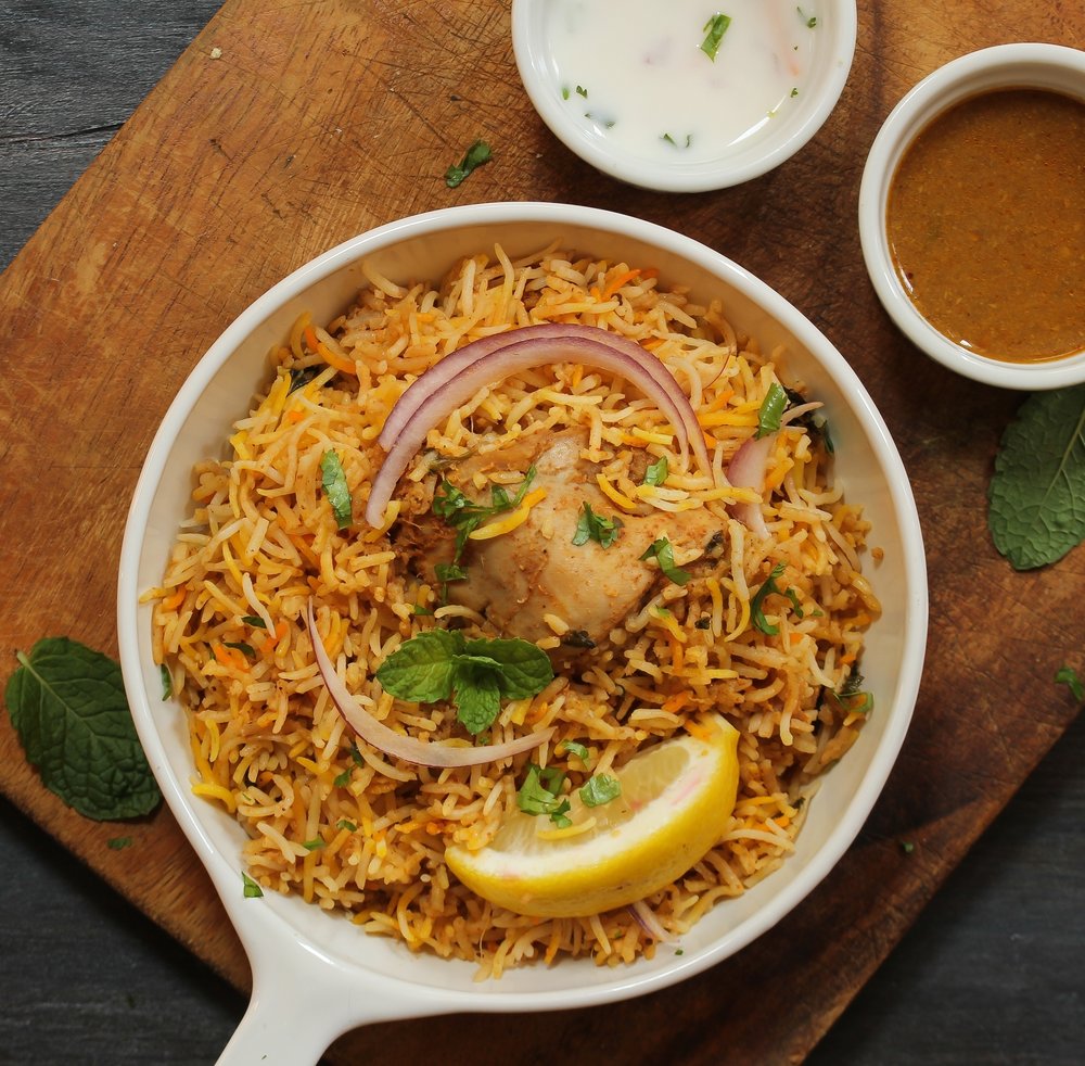 Order Hyderabadi Chicken Dum Biriyani food online from Sangam Cafe store, Morrisville on bringmethat.com