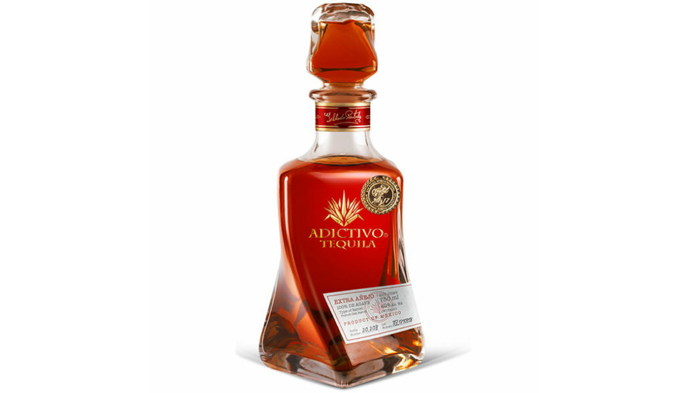 Order Adictivo Tequila Extra Añejo 750ml Bottle food online from Circus Liquor store, Los Angeles on bringmethat.com