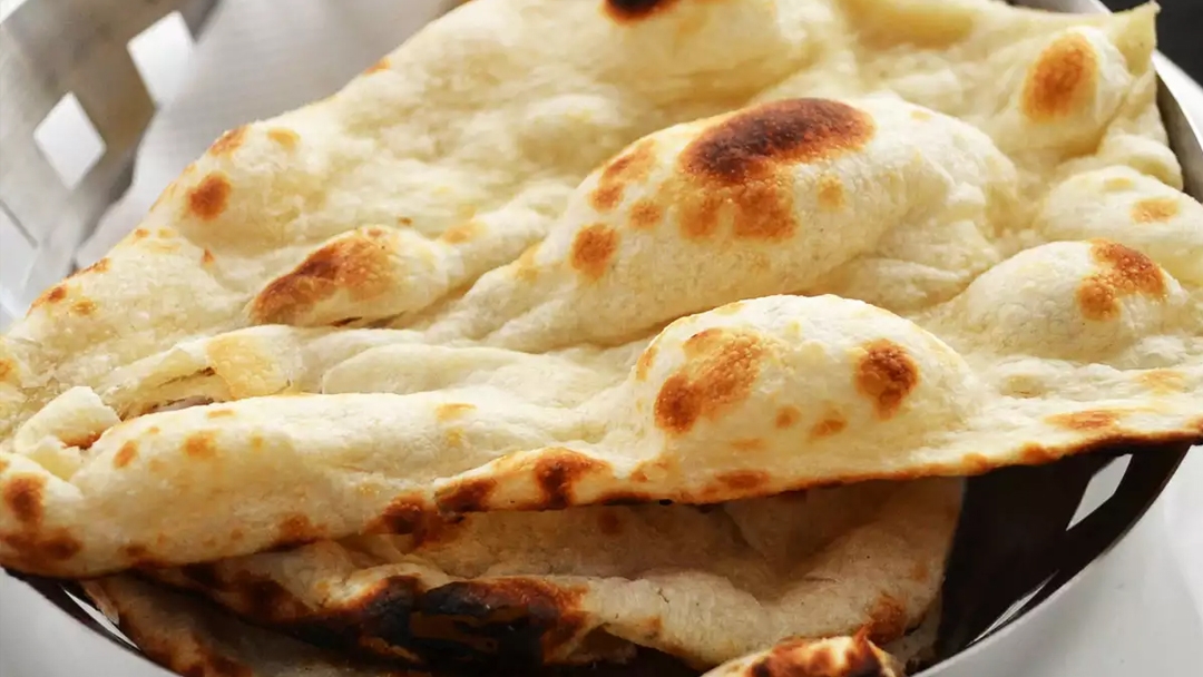 Order Butter Naan Rush food online from India Oven store, Roseville on bringmethat.com