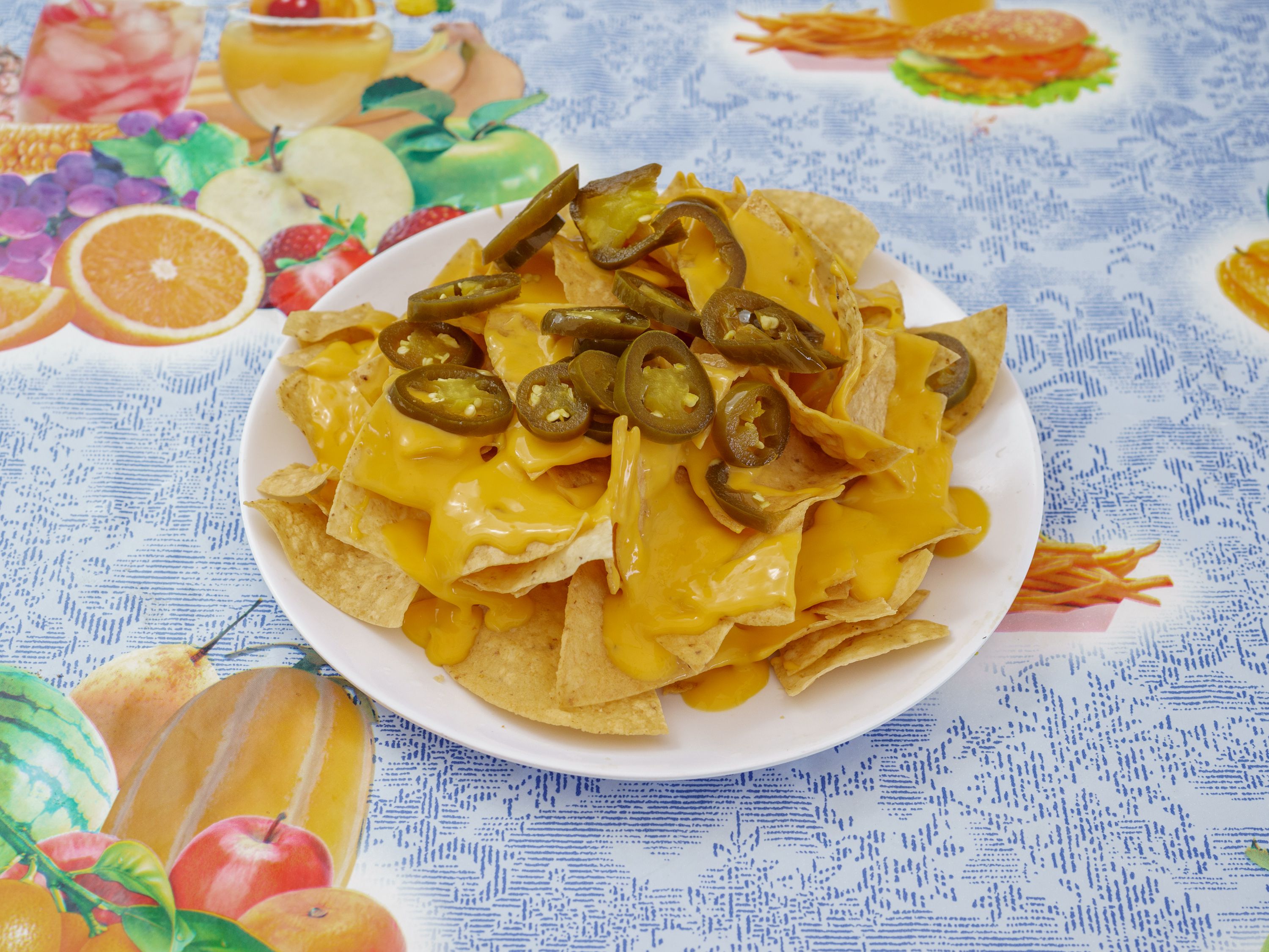 Order Nachos food online from Pacos Tacos store, Fullerton on bringmethat.com