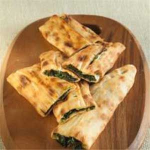 Order Spinach Pide food online from Magic Bites Bakery store, Arlington on bringmethat.com