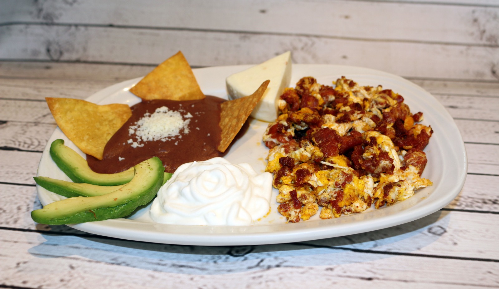 Order Huevos con Chorizo food online from El Rinconcito Latino store, Bound Brook on bringmethat.com