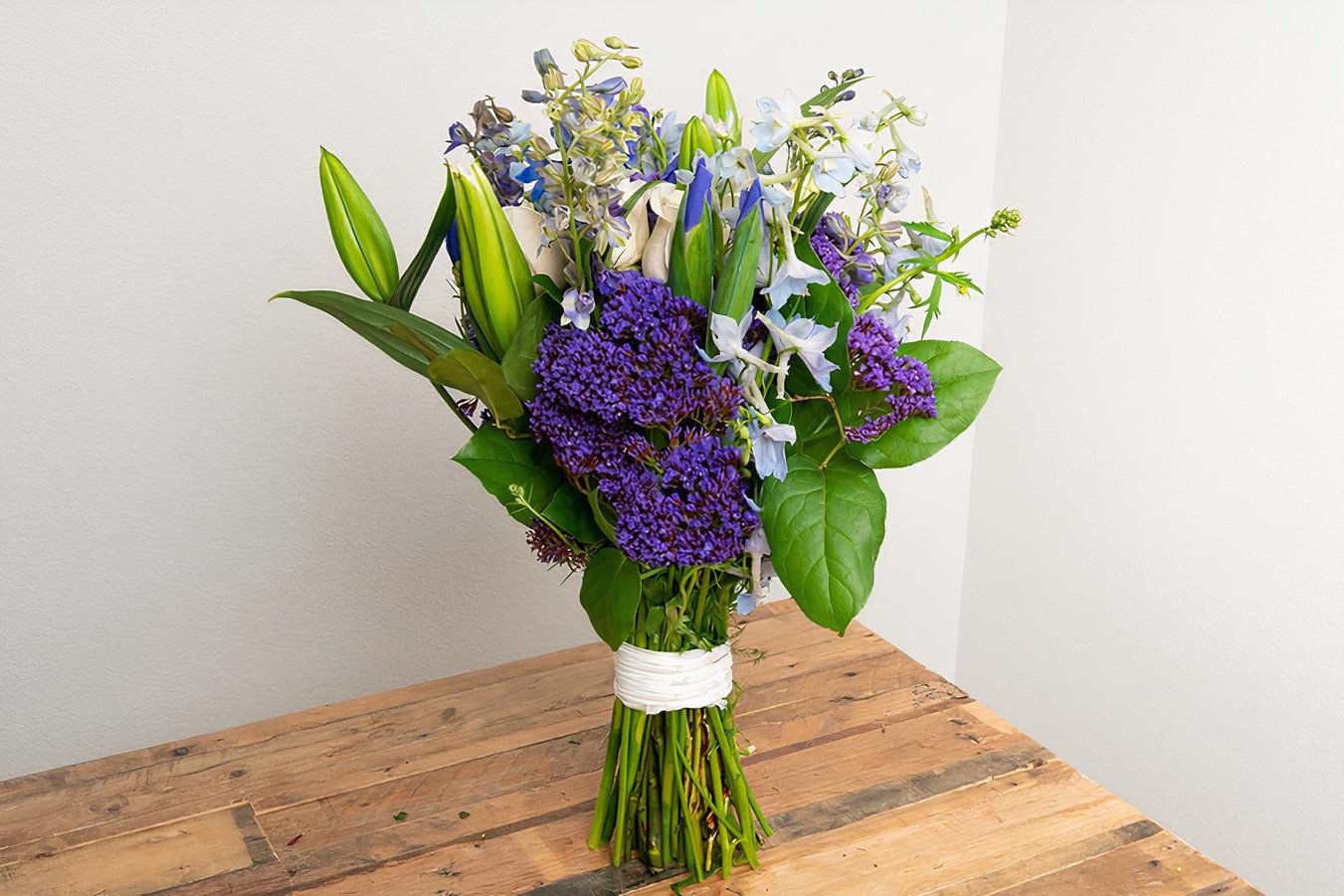 Order White, Blue, Purple Wrapped Bouquet food online from @Flowers store, Santa Barbara on bringmethat.com
