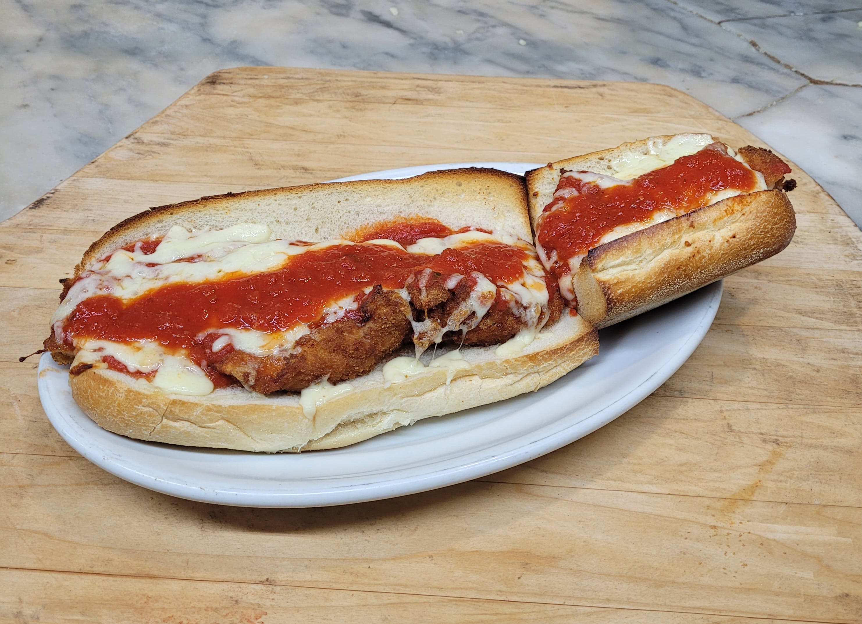 Order Chicken Cutlet Parm Sub - Hot Subs food online from Rhythm And Spice Pizzeria And Grill store, New Brunswick on bringmethat.com