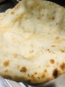 Order Garlic Cheese Naan food online from Masala 2 Indian Restaurant store, Hollywood on bringmethat.com
