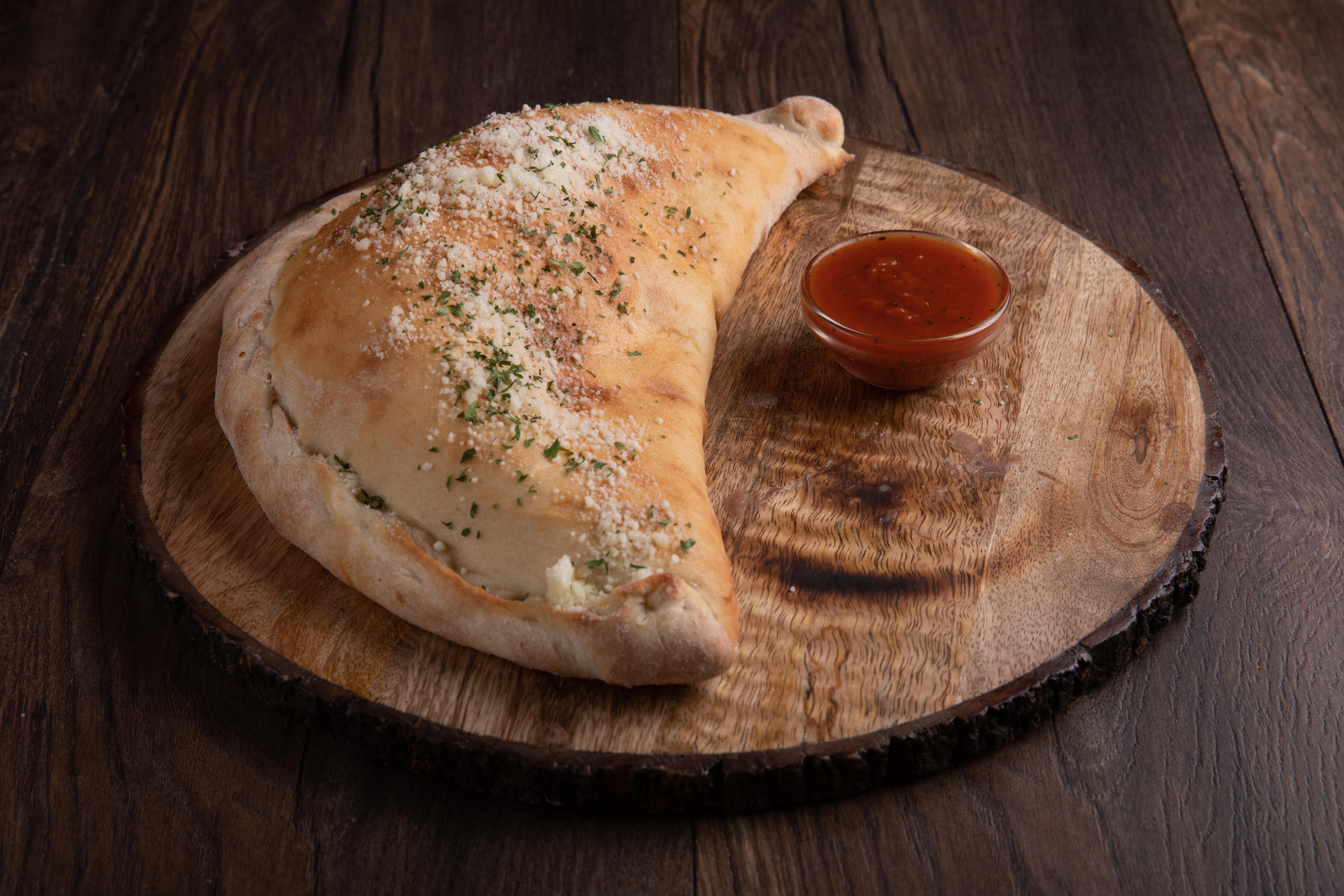 Order Calzone - Calzone food online from 500 Degrees Pizzeria store, Charlotte on bringmethat.com
