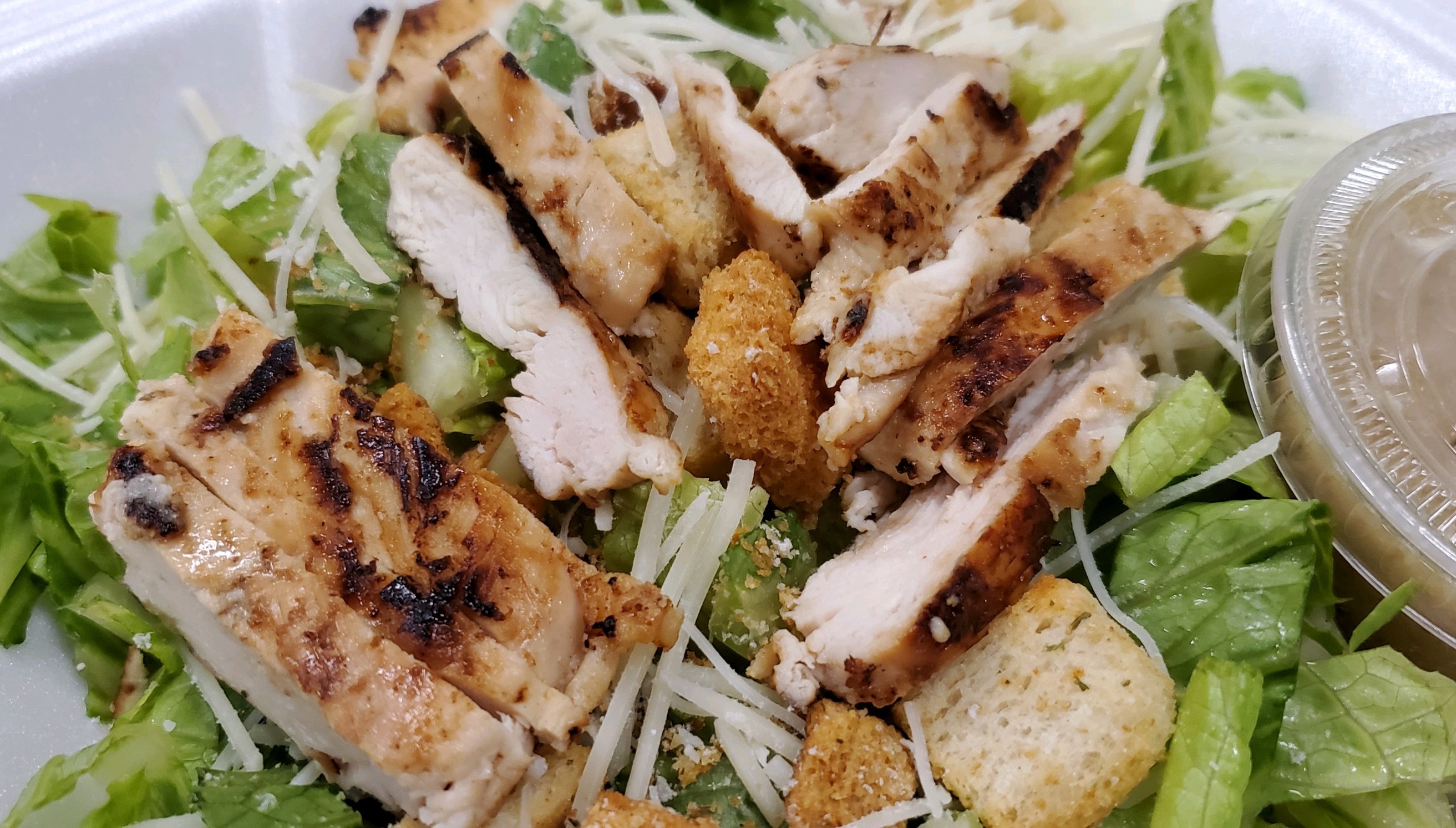 Order Grilled Chicken Caesar Salad food online from Knuckles Knockout Grill store, Rochester on bringmethat.com