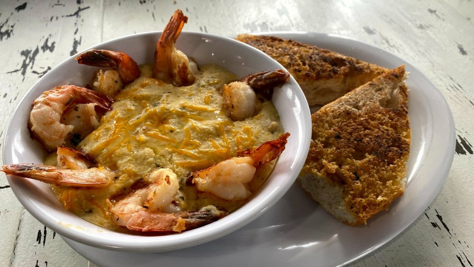 Order Shrimp N Grits food online from The Station Seafood Co. store, Houston on bringmethat.com