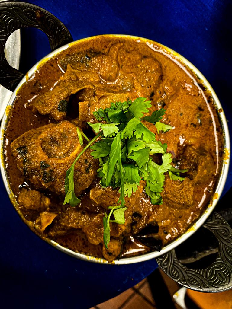 Order Goat Vindaloo food online from Star of India Restaurant store, Little Rock on bringmethat.com