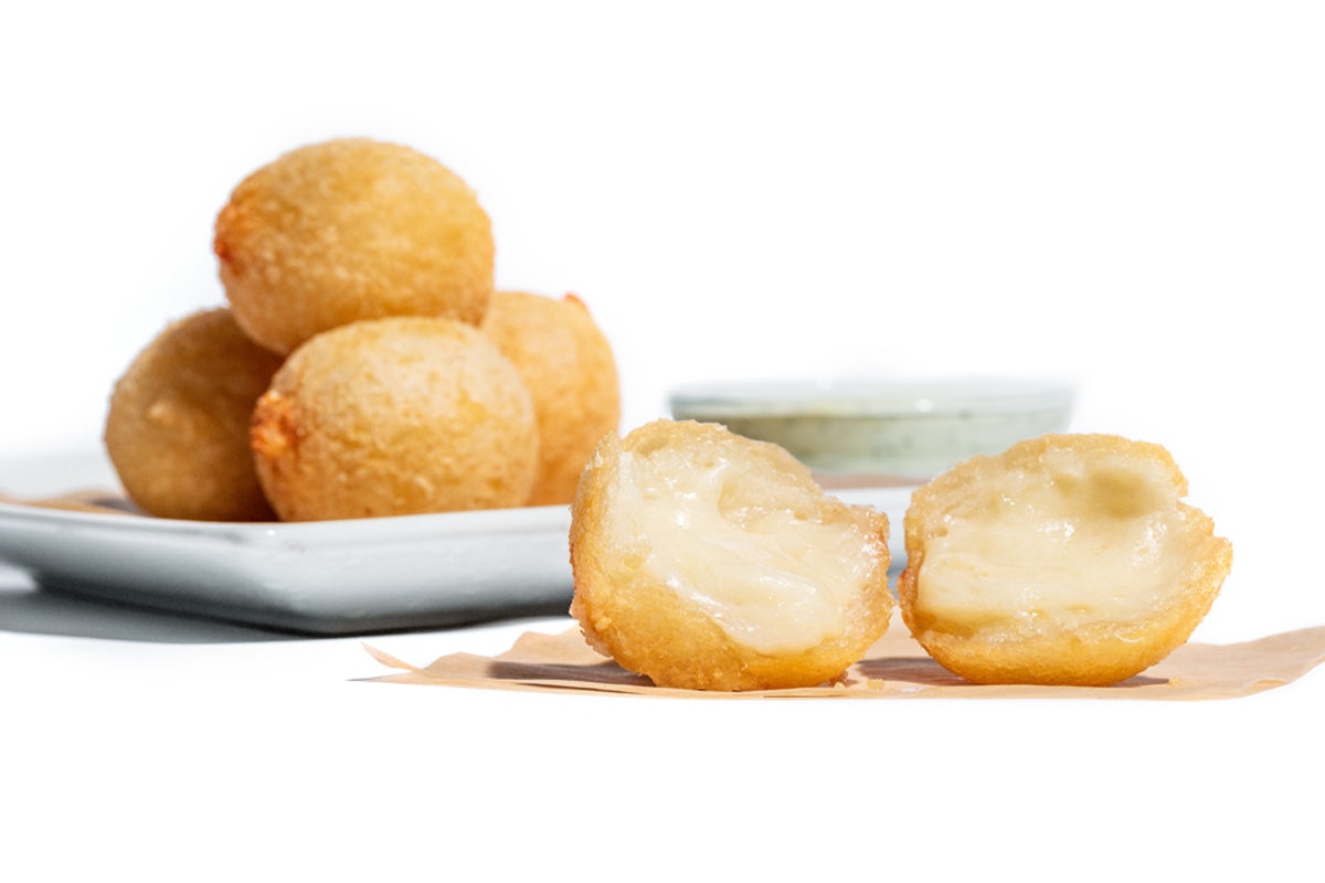 Order Cheesy Yuca Bites* food online from Pollo Tropical store, Miami on bringmethat.com