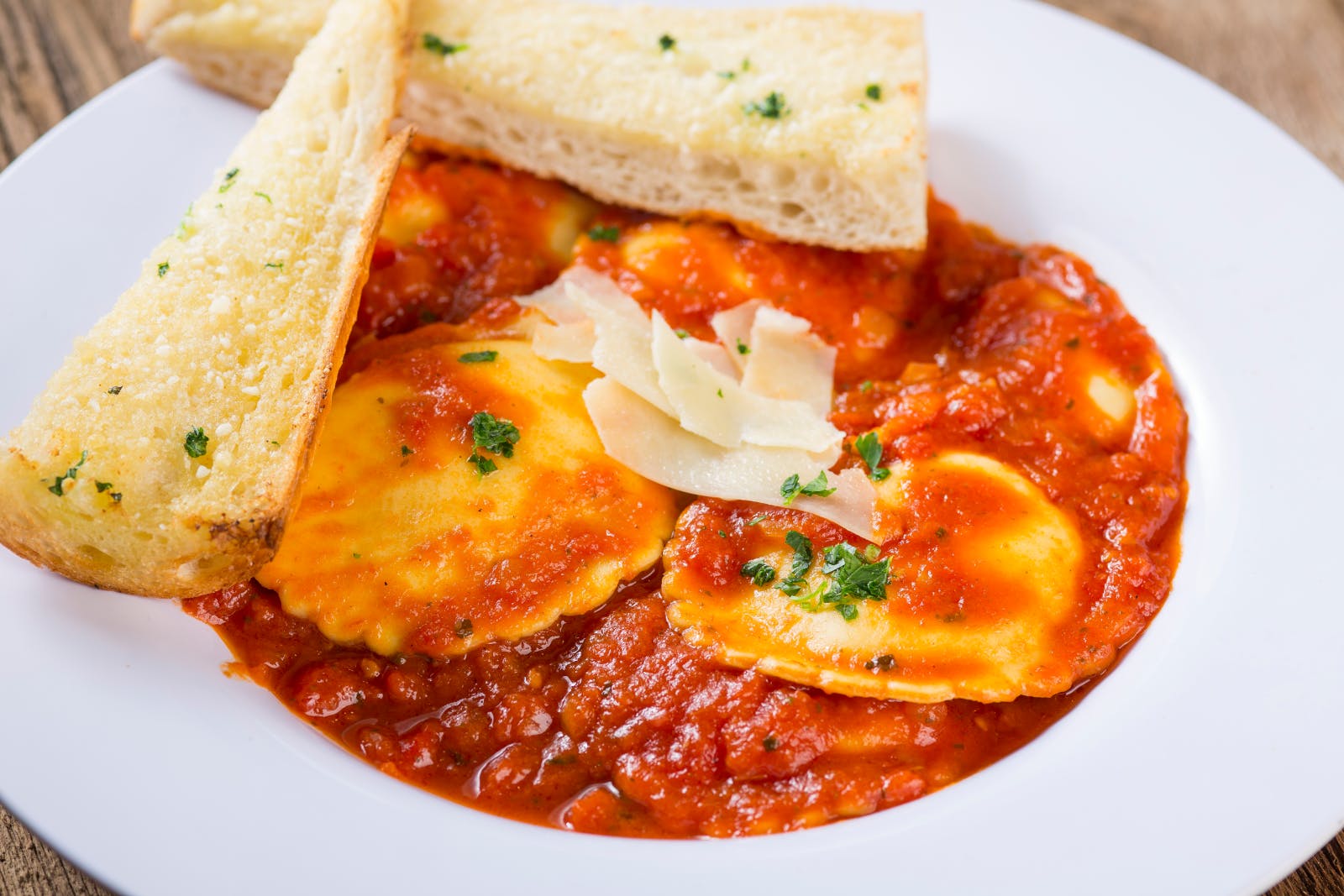 Order Four Cheese Blend Ravioli - Serves 1-3 food online from Rosati's Pizza store, Glenview on bringmethat.com