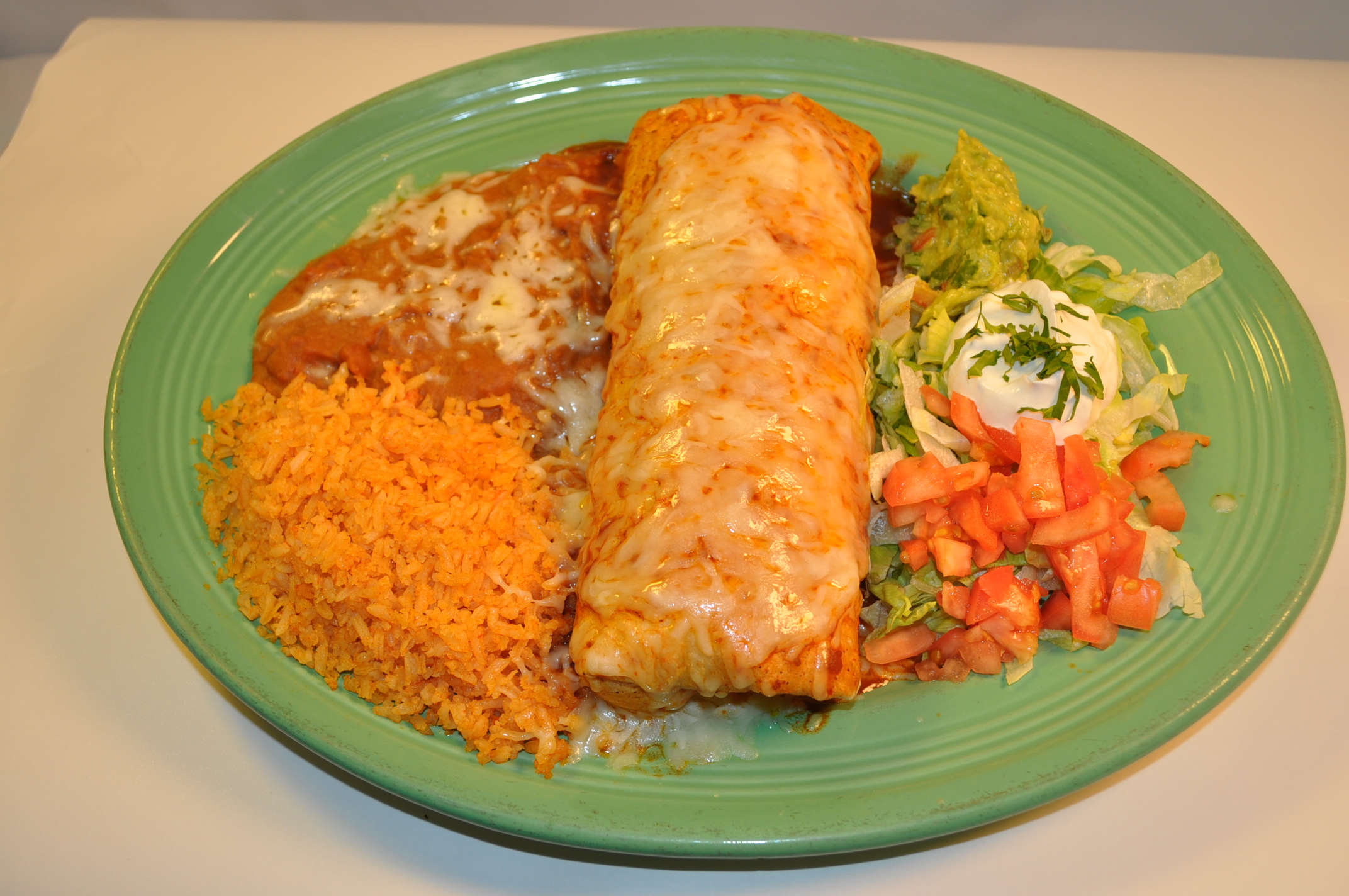 Order Burrito Suizo food online from Good Tequilas Mexican Grill store, Glendale Heights on bringmethat.com